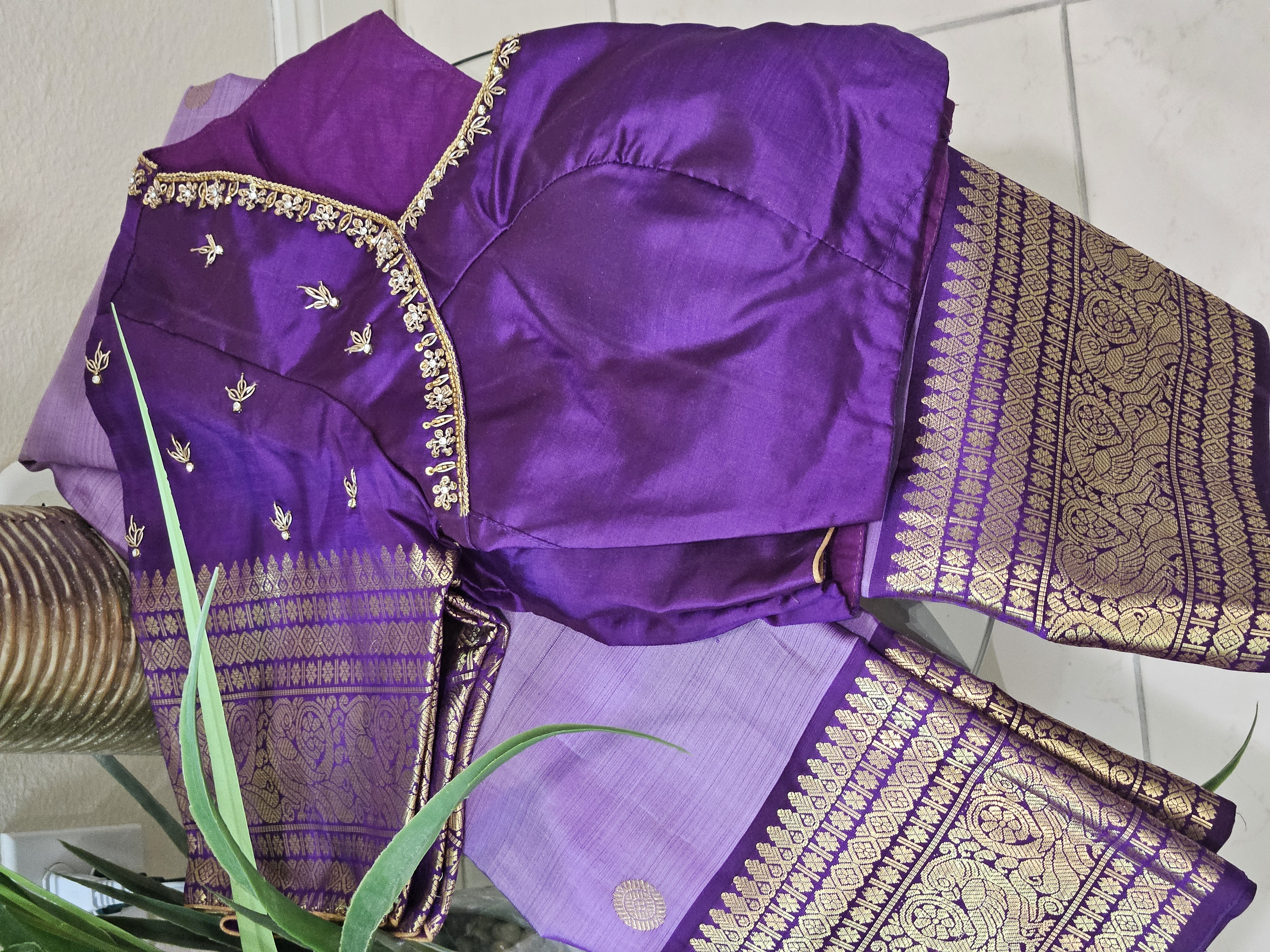 Radiant purple Kanchipuram silk saree with intricate 2gm pure gold zari work, traditional Indian wedding attire.
