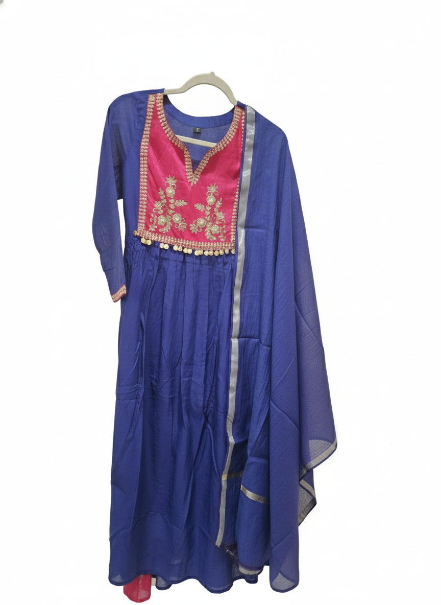 Indigo blue mul Chanderi suit set with pink embroidered yoke, gold coin accents, and matching dupatta on hanger