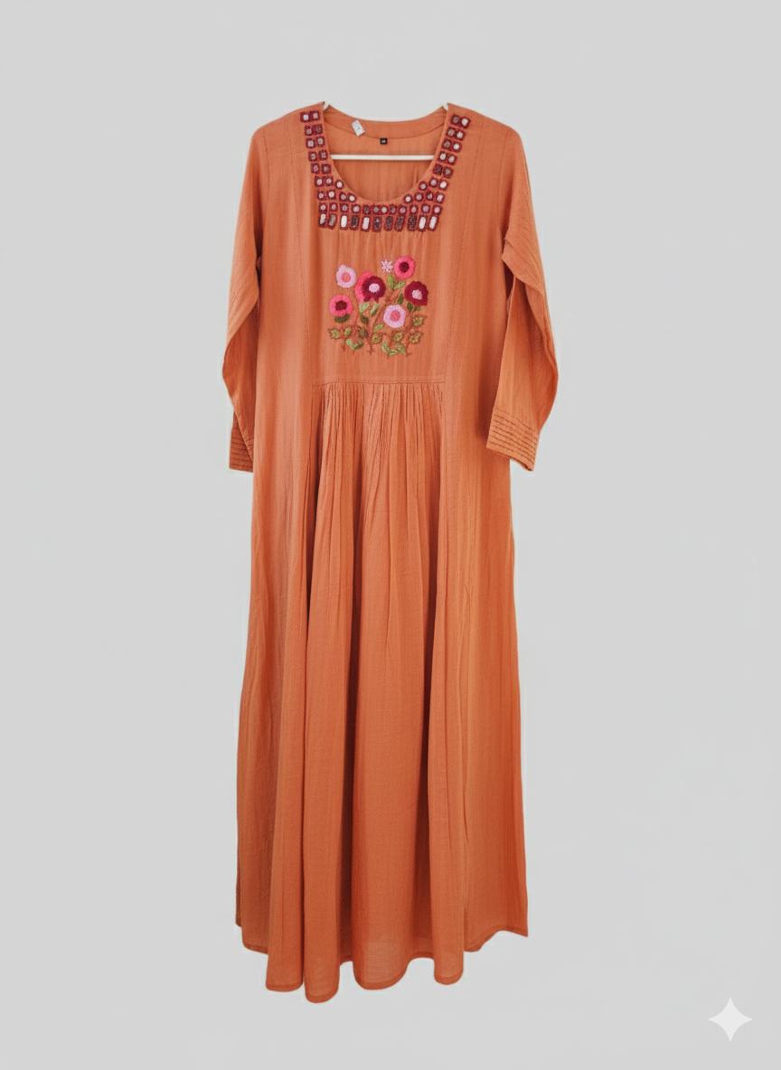 Rustic orange mul cotton dress with floral and geometric embroidery, long sleeves, and pleated skirt, Indian ethnic wear.