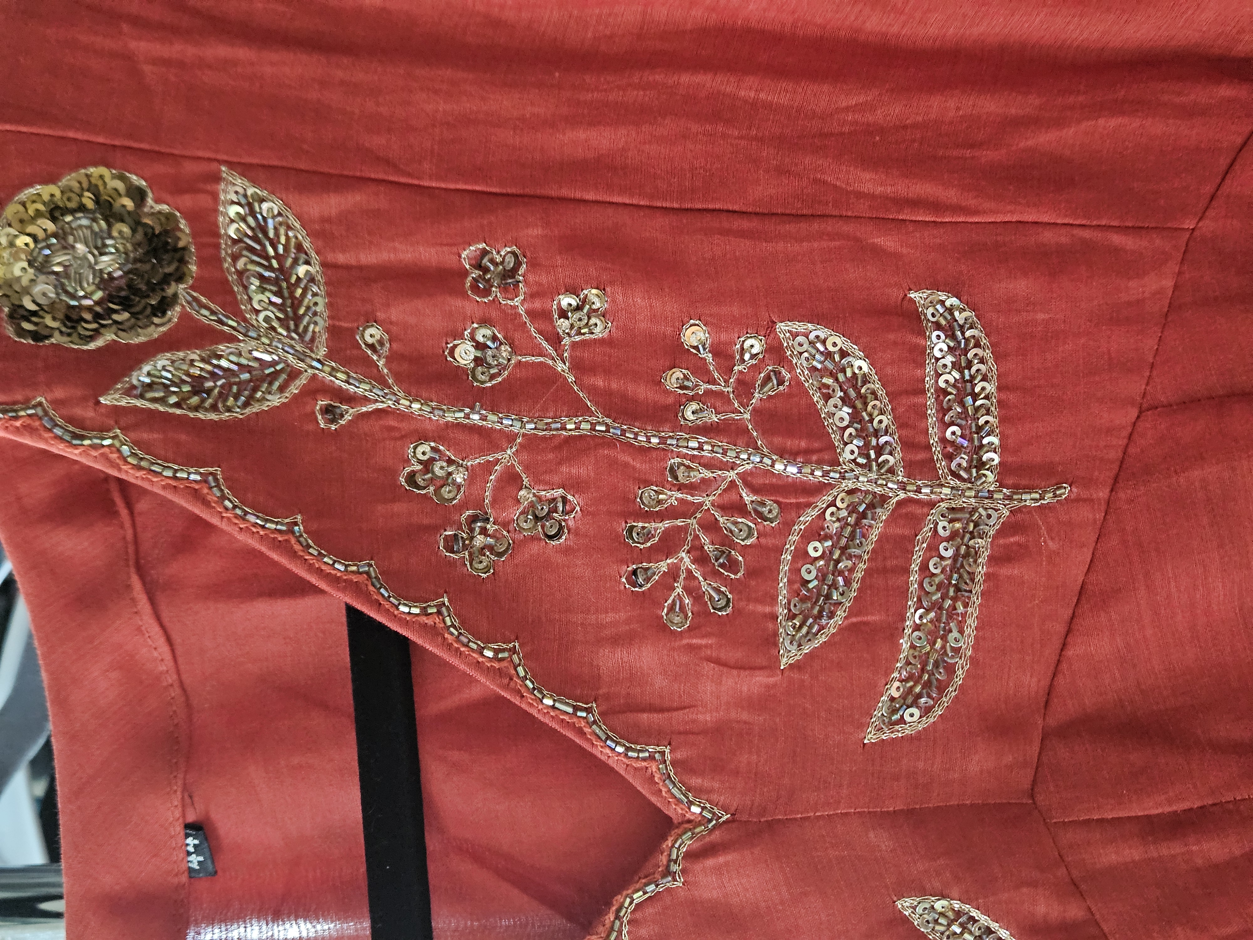 Red pure mul Chanderi Anarkali dress featuring intricate gold zari floral embroidery, ideal for weddings and festivals.