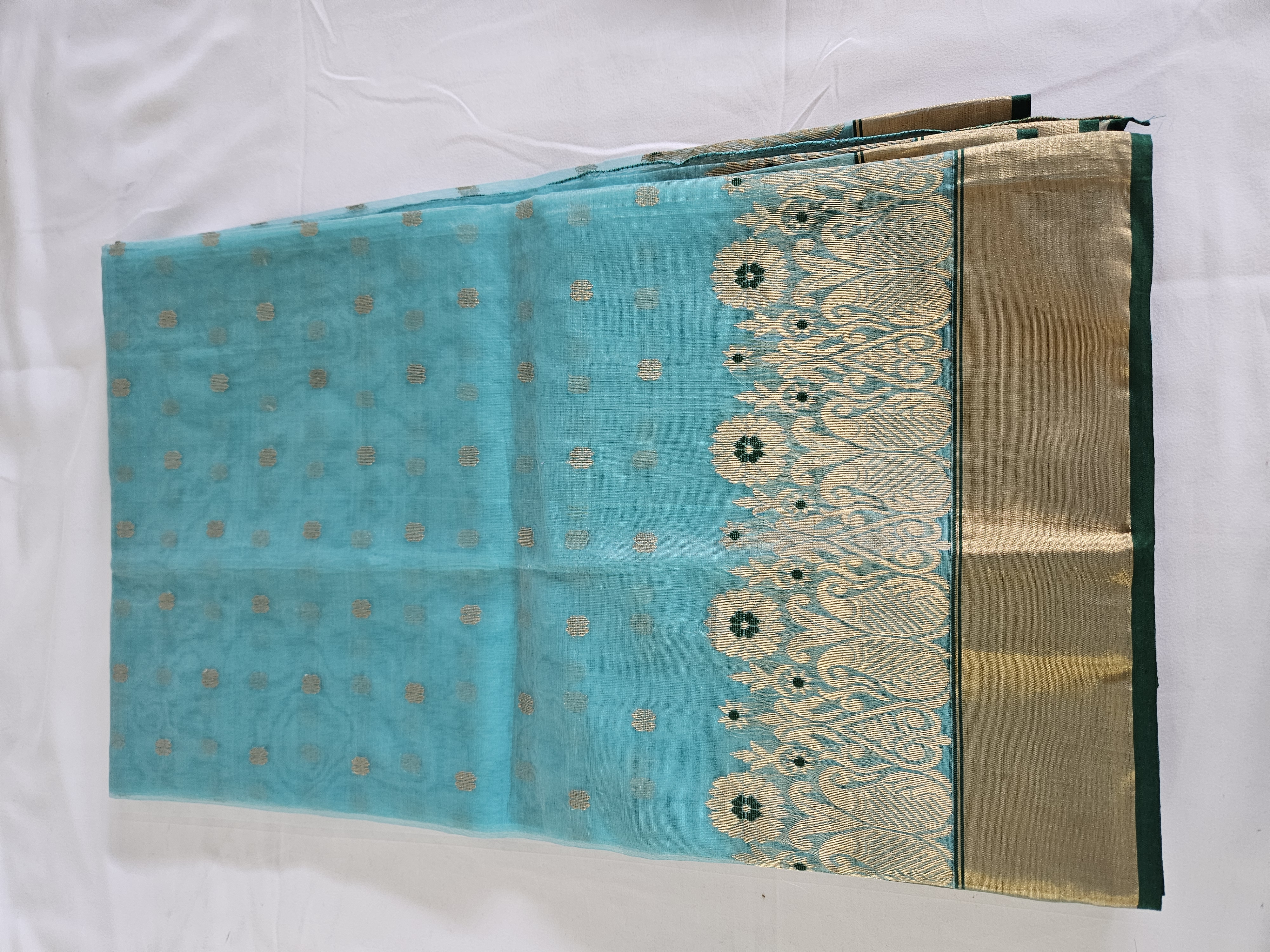 Handwoven pure Chanderi Katan silk saree in aqua blue with golden zari borders and multicolor floral motifs, elegant finish