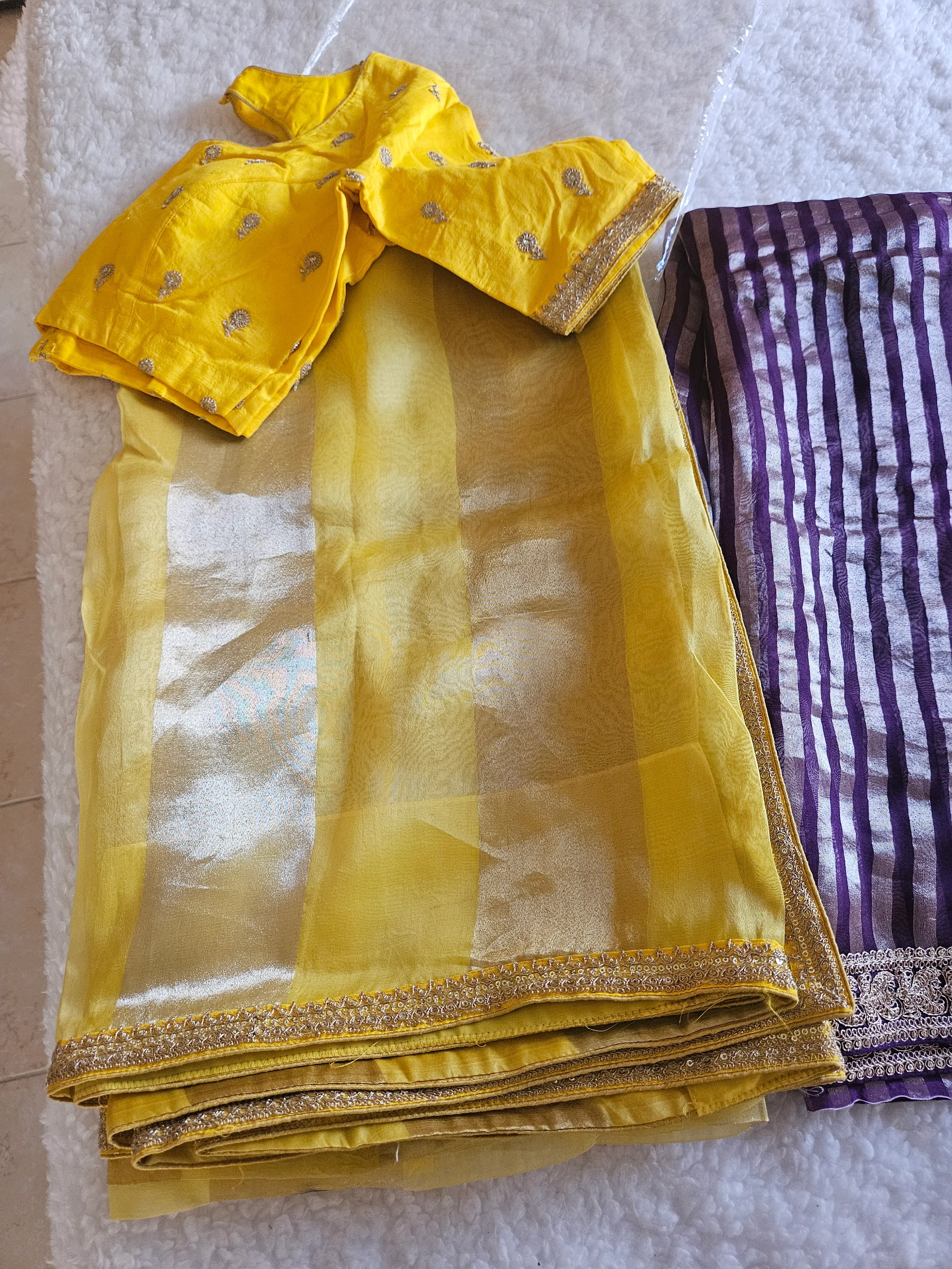 Pure Banarasi tissue silk saree in golden beige with intricate zari work, paired with a yellow blouse, ideal for weddings.