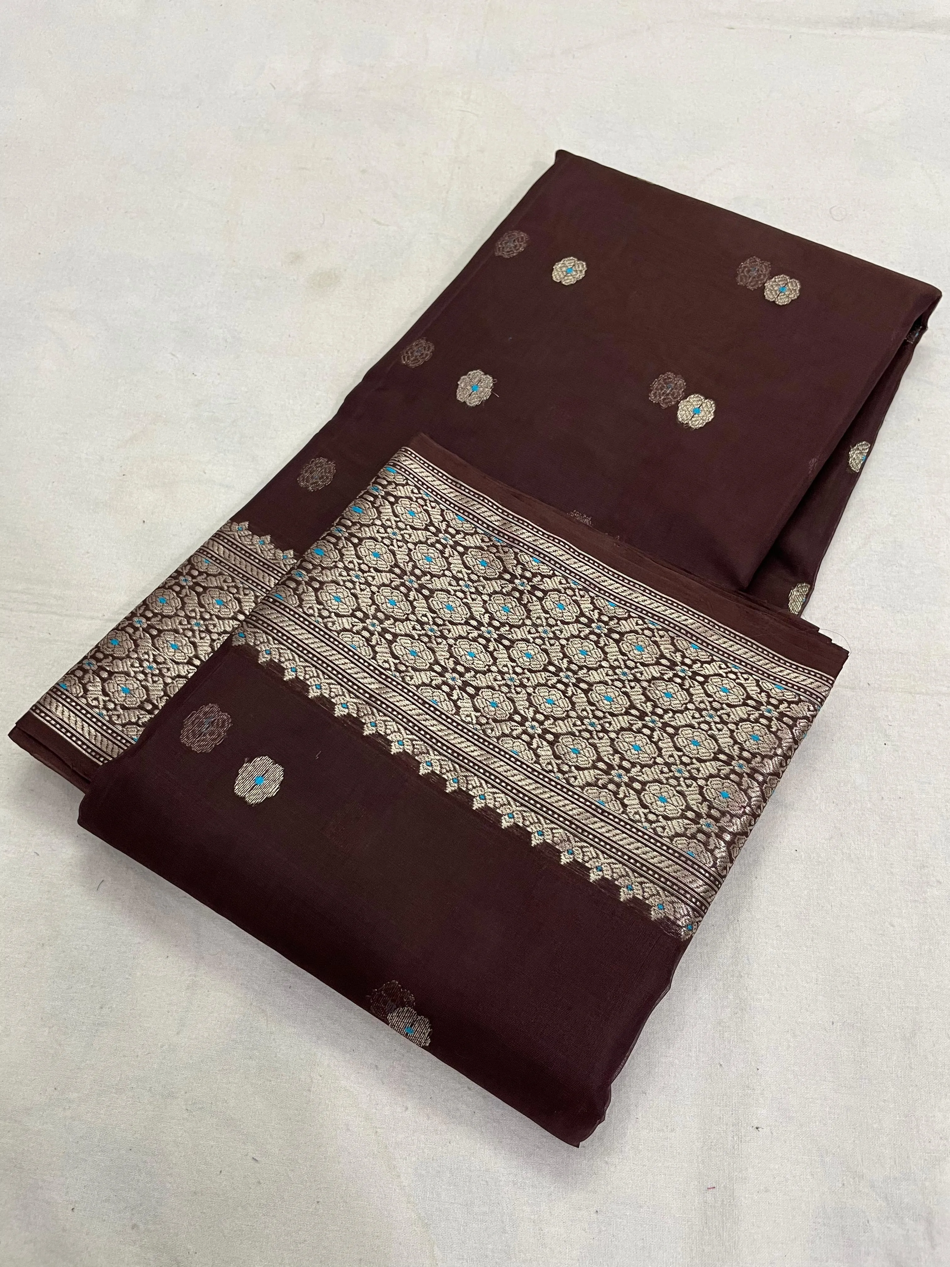Golden beige handwoven Chanderi silk saree with intricate zari border and delicate floral motifs, perfect for weddings and festivals