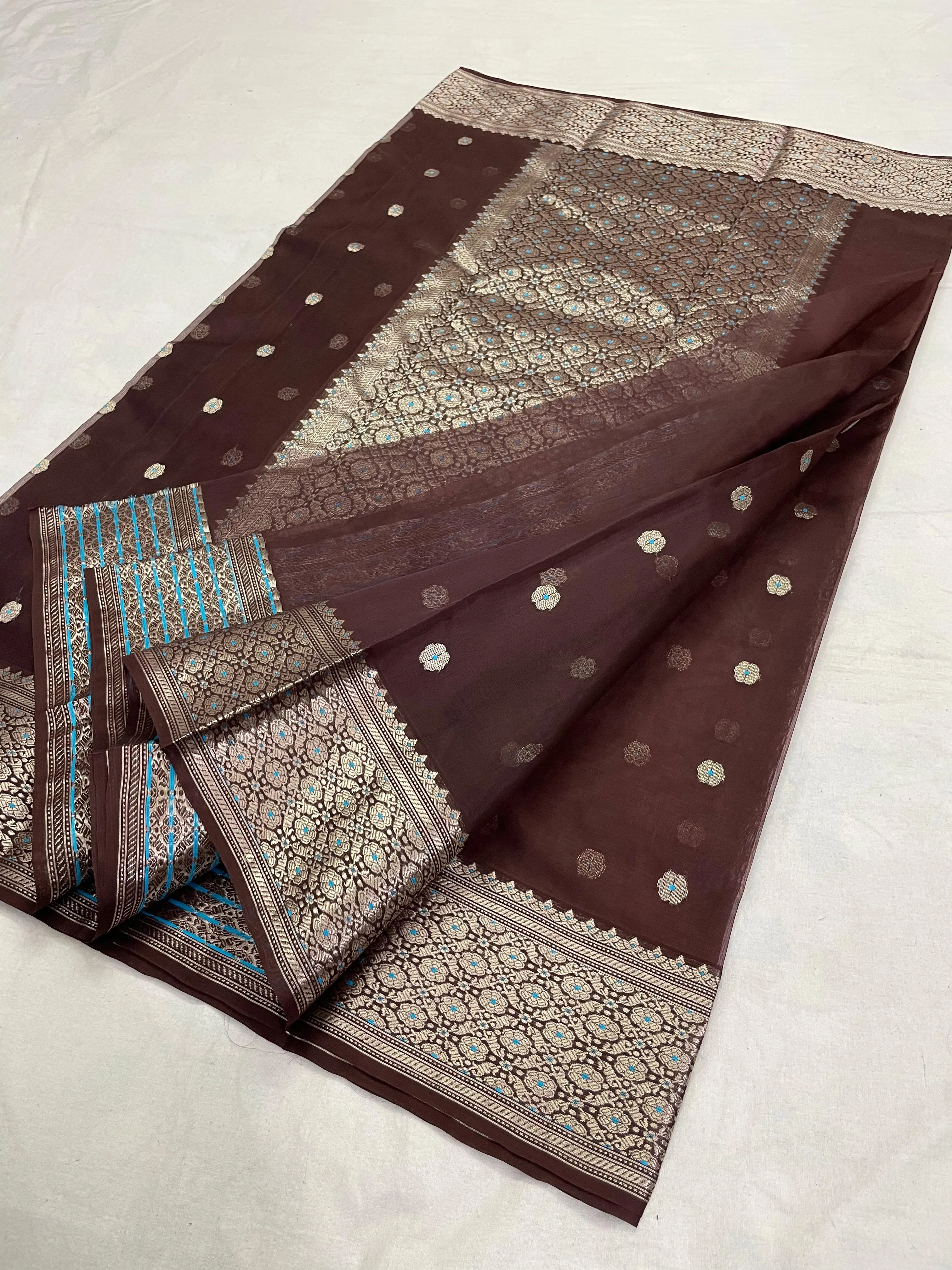 Golden beige handwoven Chanderi silk saree with intricate zari borders and delicate motifs, ideal for weddings and festive occasions