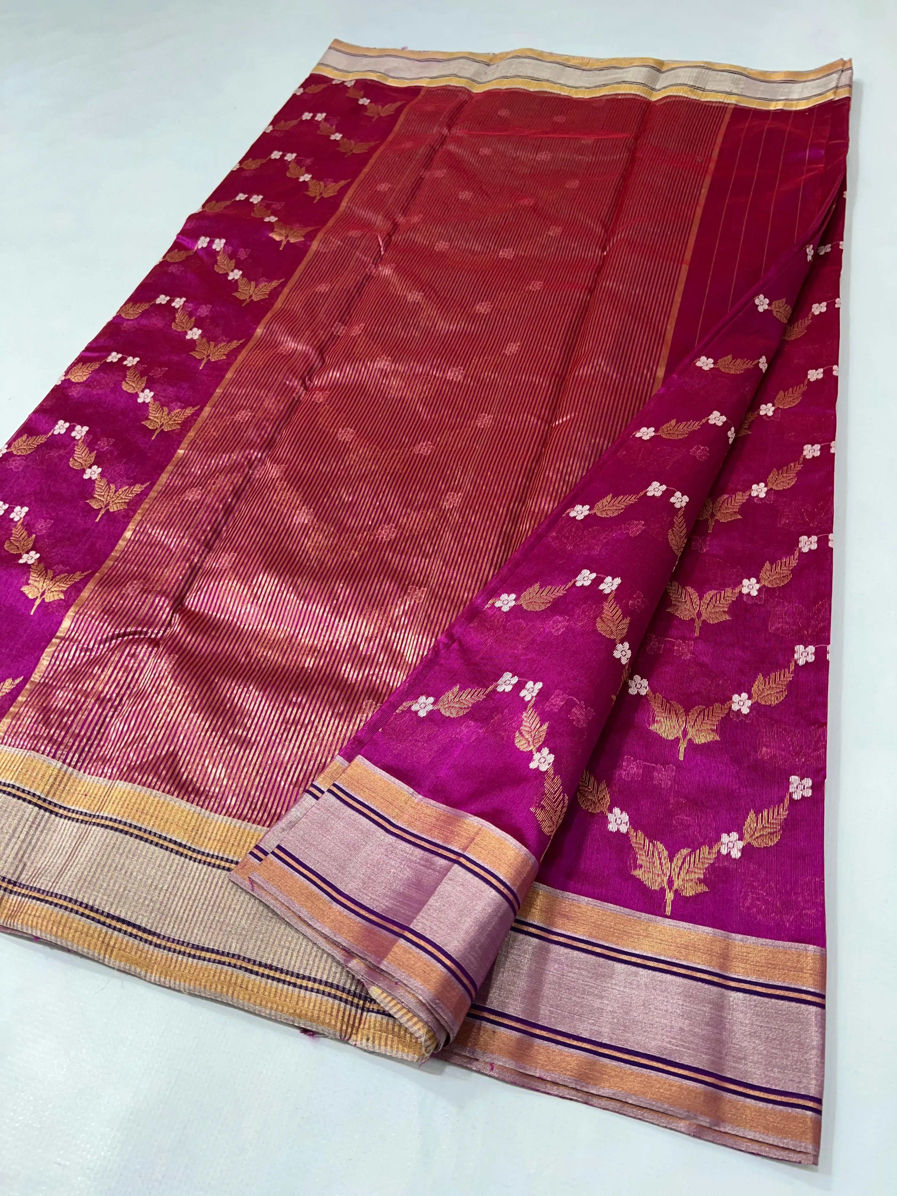 Pure Chanderi silk pattu saree in golden beige and magenta with handcrafted maggam work and floral zari motifs.
