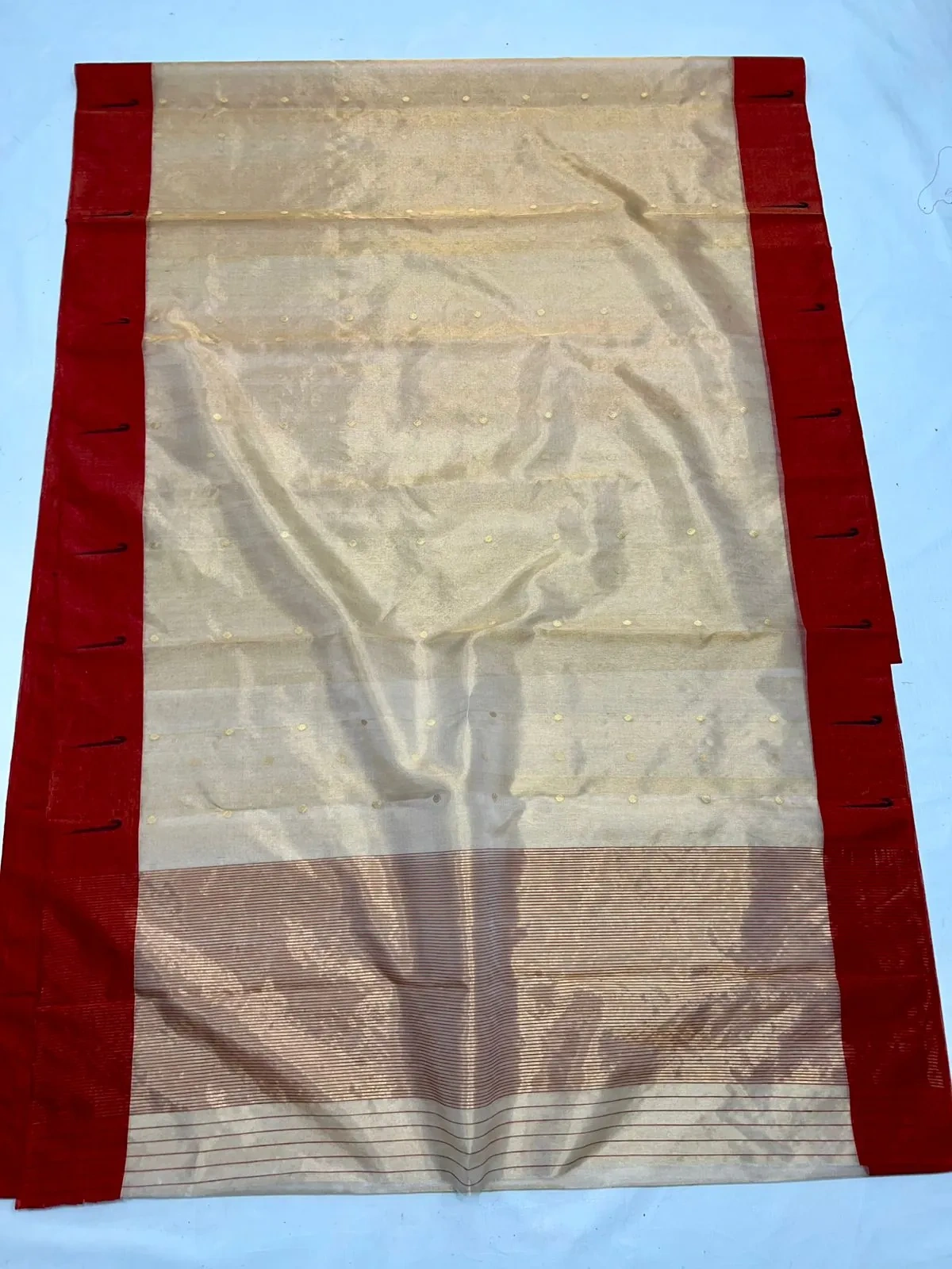 Pure Chanderi silk pattu saree in gold with a rich red border, subtle woven motifs, and matching maggam work blouse for weddings