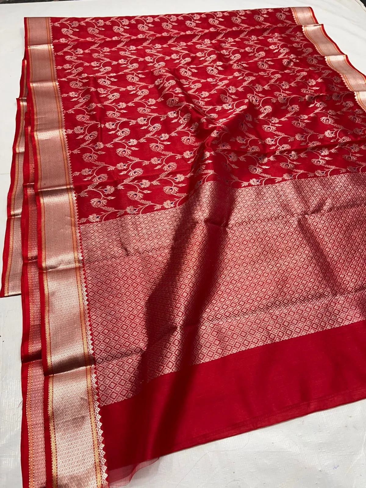 Pure Chanderi silk saree in gold pastel with intricate zari embroidery, floral motifs, and a shimmering gold border.