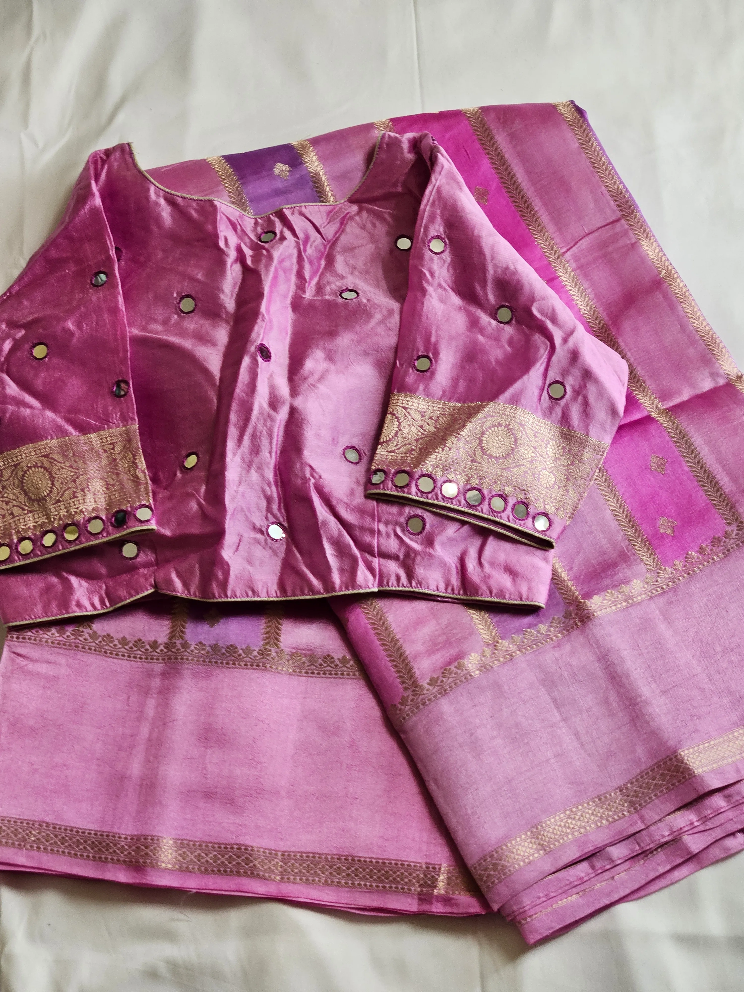 Handwoven pure raw mango silk saree in vibrant pink with gold zari borders, paired with a matching mirror work blouse