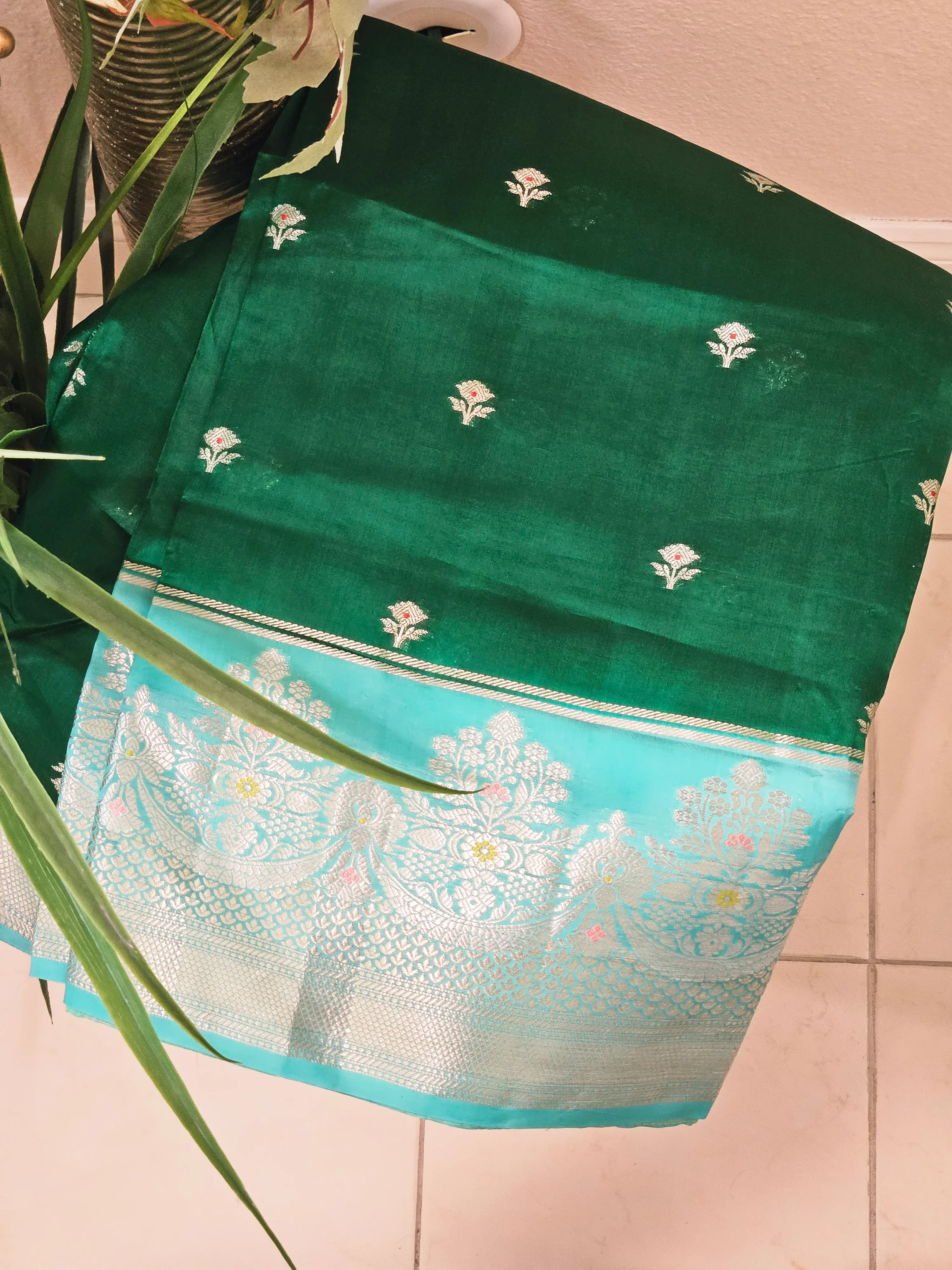 Handwoven pure raw mango silk saree in earthy yellow-green with silver zari border and small floral motifs, Indian ethnic wear