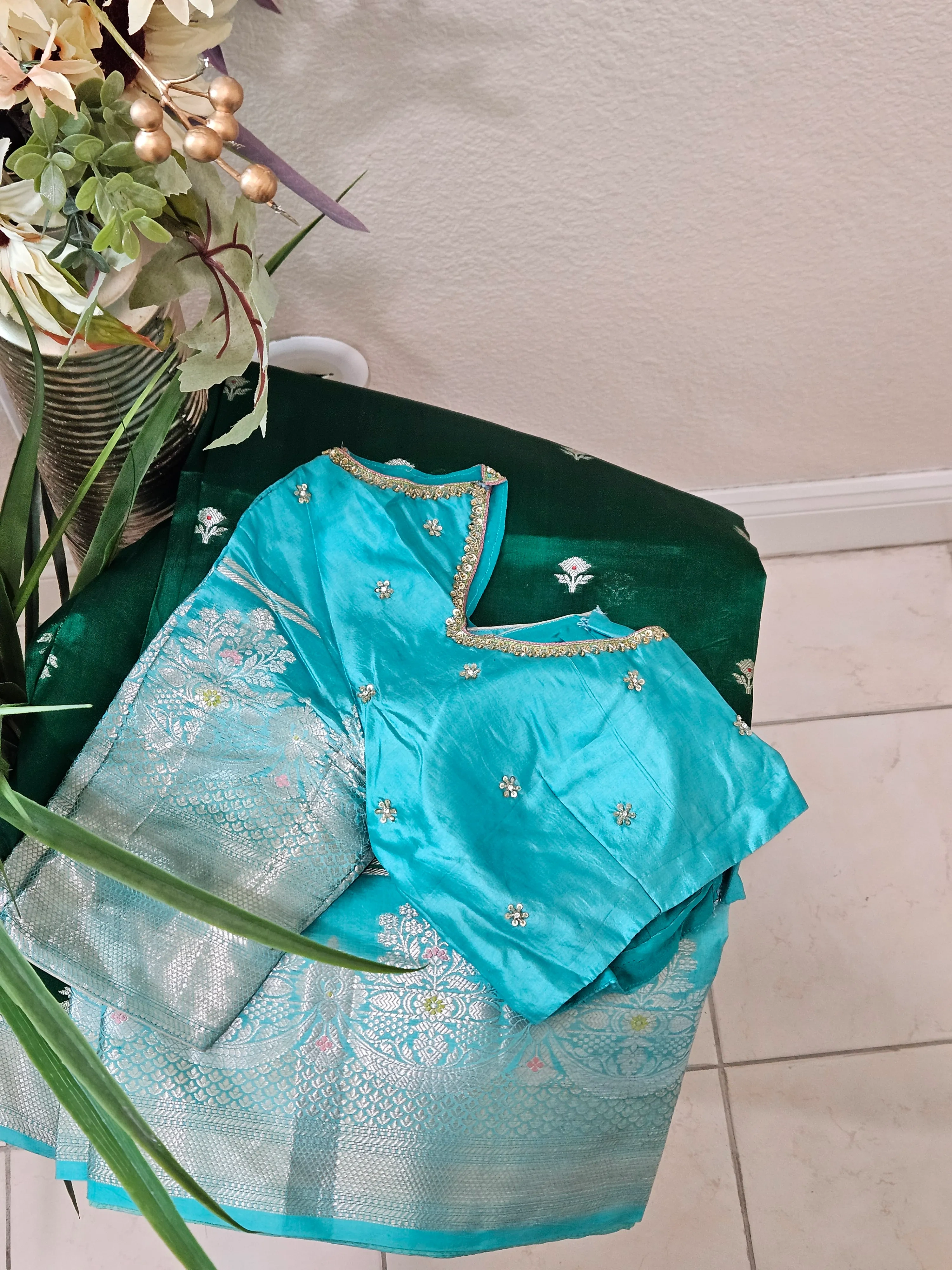 Handwoven pure raw mango silk saree in earthy yellow-green with intricate silver zari work, paired with a matching blouse.
