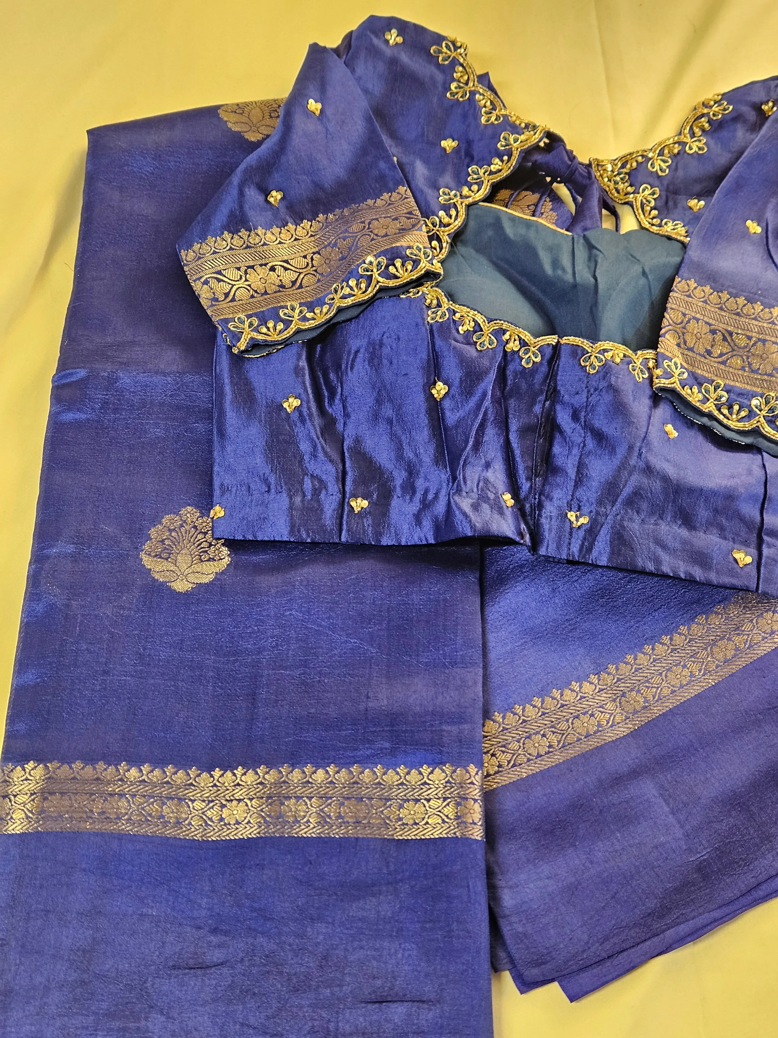Handwoven pure raw mango silk saree in deep royal blue with gold zari borders and matching embroidered blouse on display