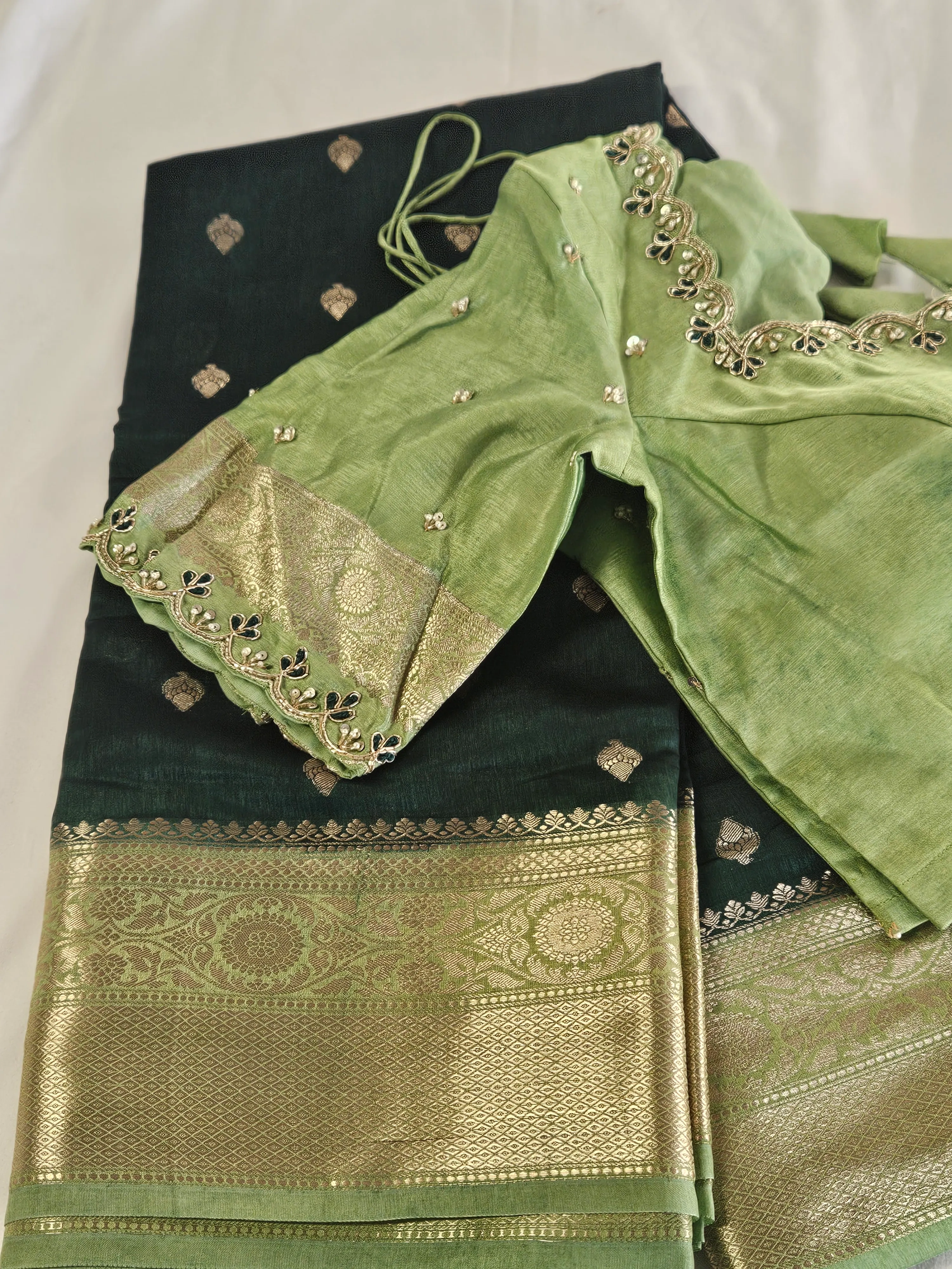 Handwoven pure raw mango silk saree in golden yellow with intricate gold zari border, paired with green blouse featuring delicate embroidery