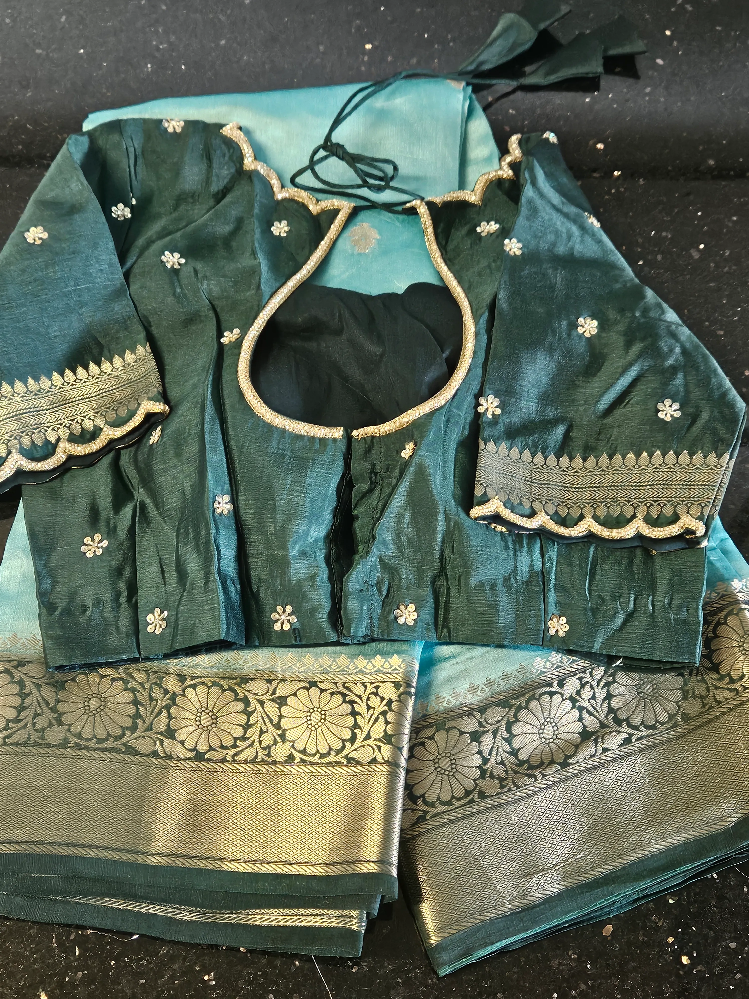Luxury pure raw mango silk saree in teal blue with intricate gold zari border and matching embroidered blouse, festive Indian wear