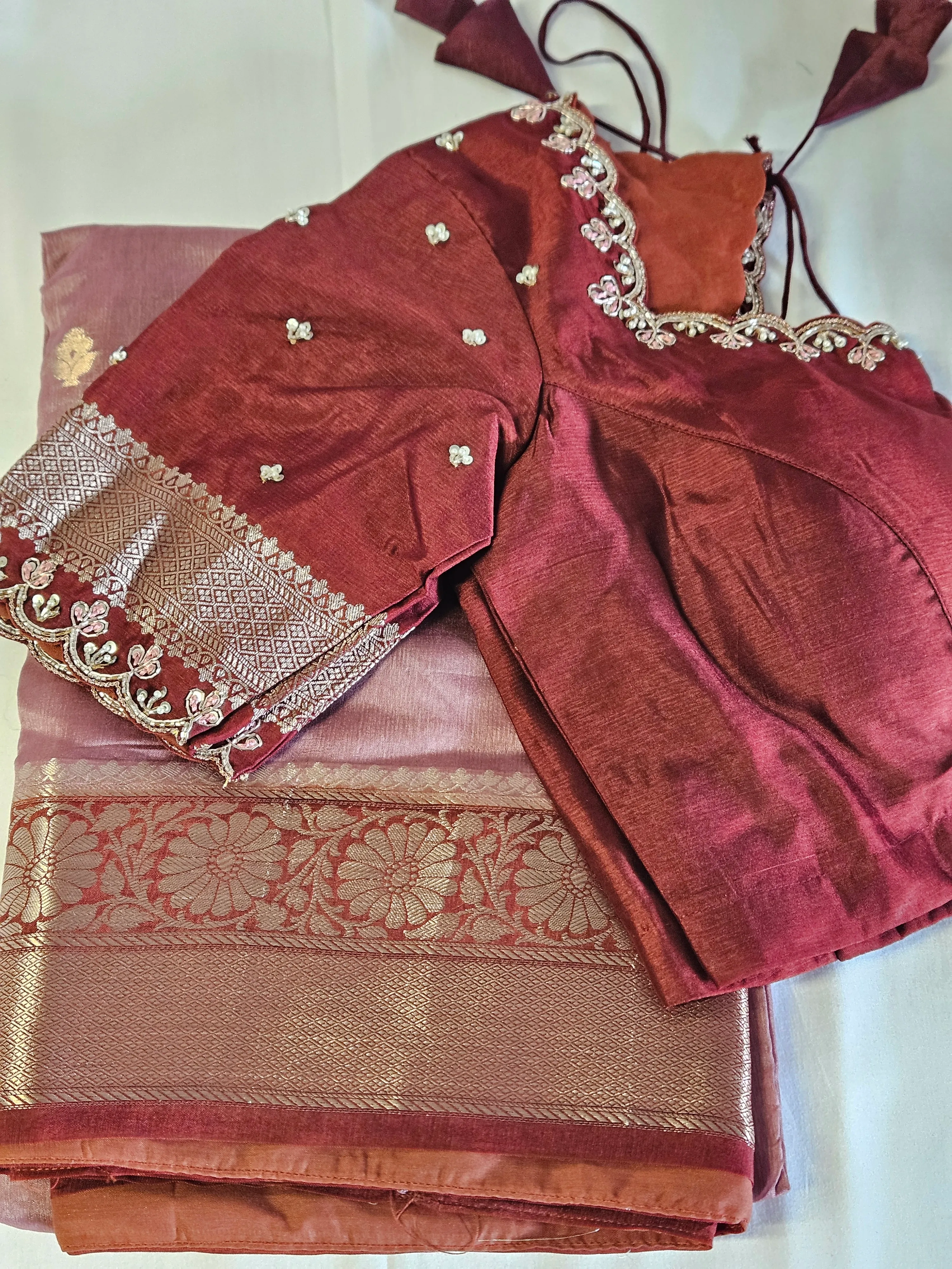 Handwoven pure raw mango silk saree in earthy tones with intricate zari border, paired with maroon embroidered blouse