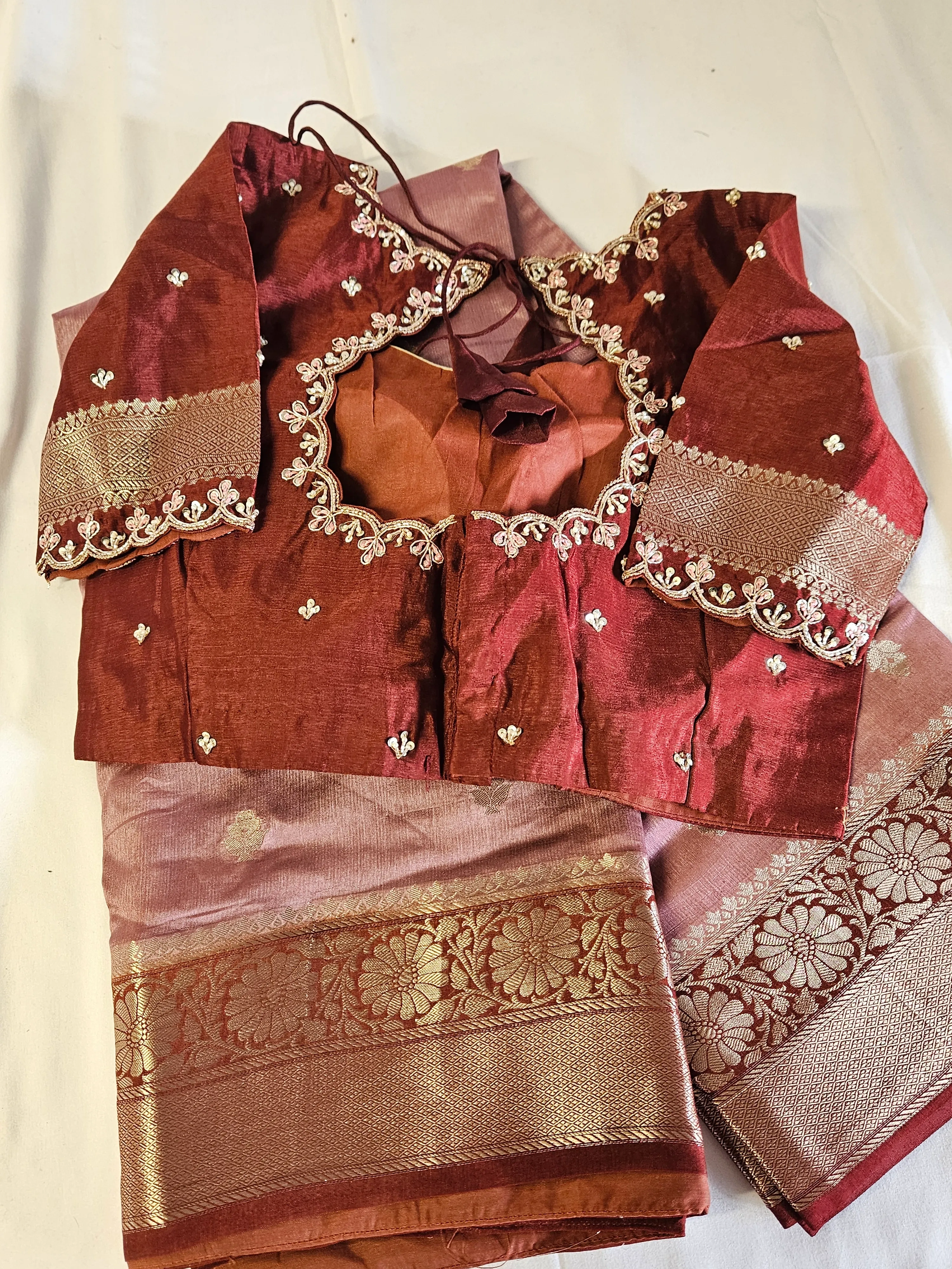 Handwoven pure raw mango silk saree in earthy tones with gold zari border, paired with maroon embroidered blouse