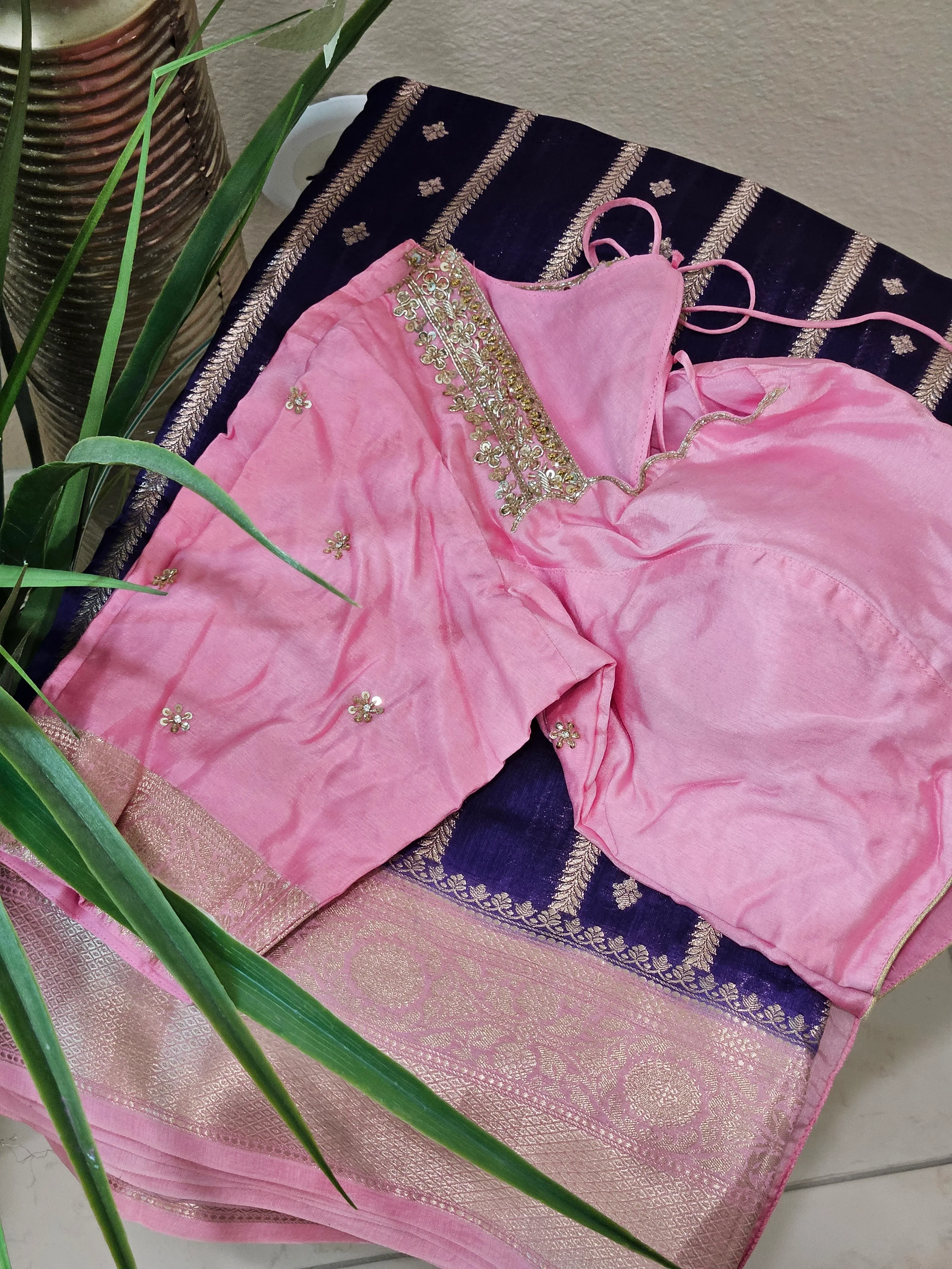 Handcrafted pure raw mango silk saree in deep blue with gold zari border, paired with a pink embellished blouse.