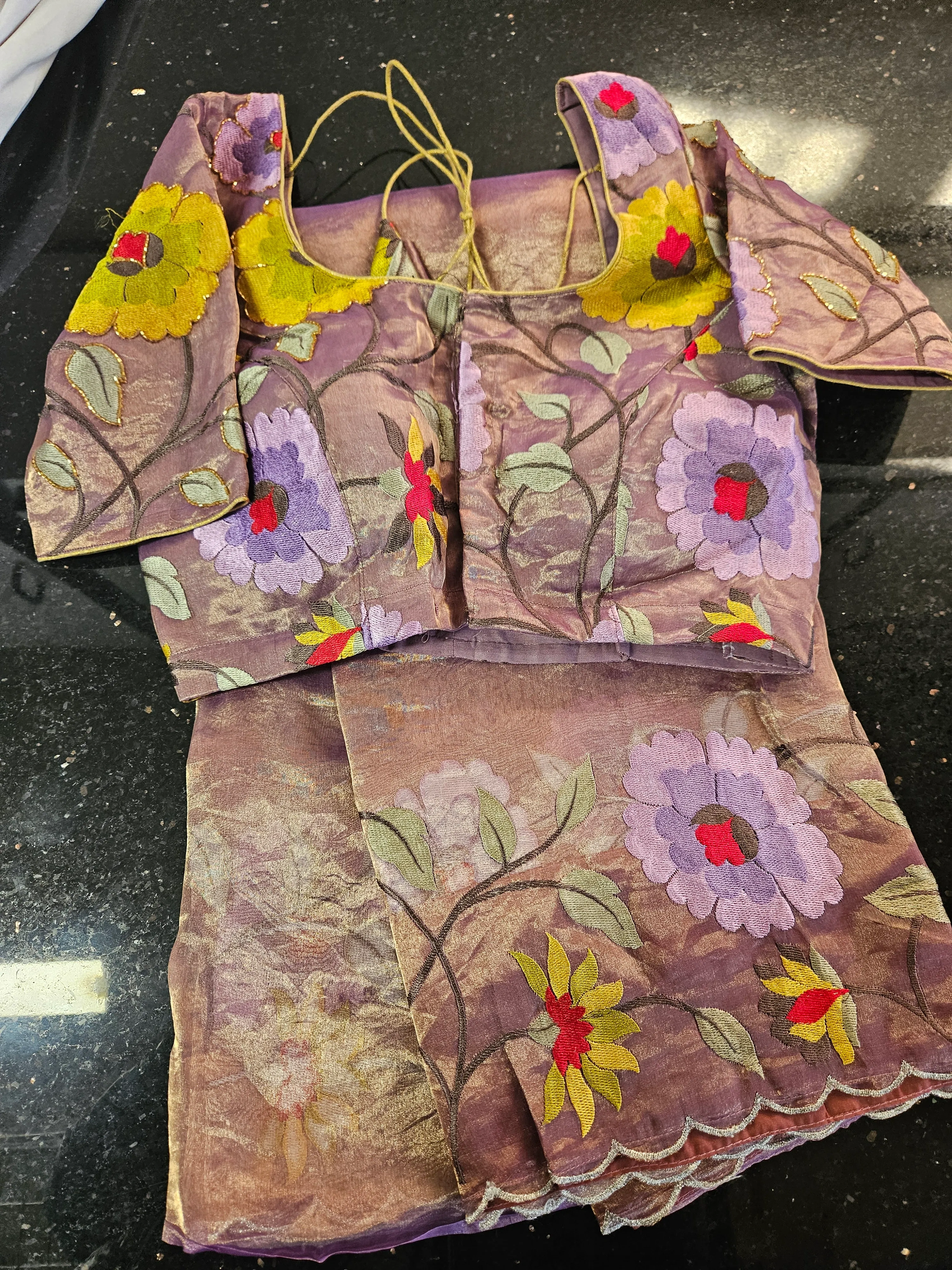 Handwoven pure Banarasi tissue saree in soft gold with golden zari, luxe shimmer, and vibrant floral patterns for weddings