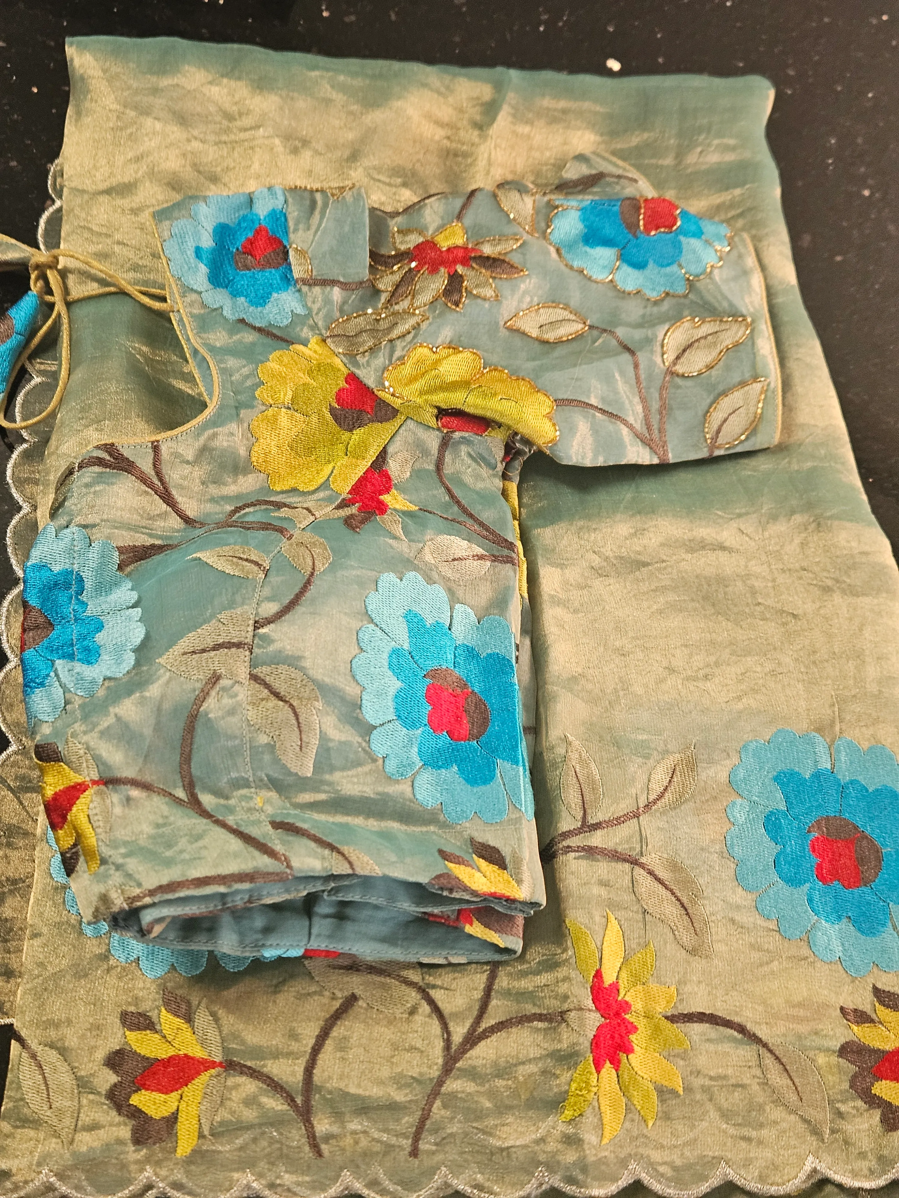 Handwoven pure Banarasi tissue saree in gold with blue and yellow floral zari embroidery, ideal for weddings and parties