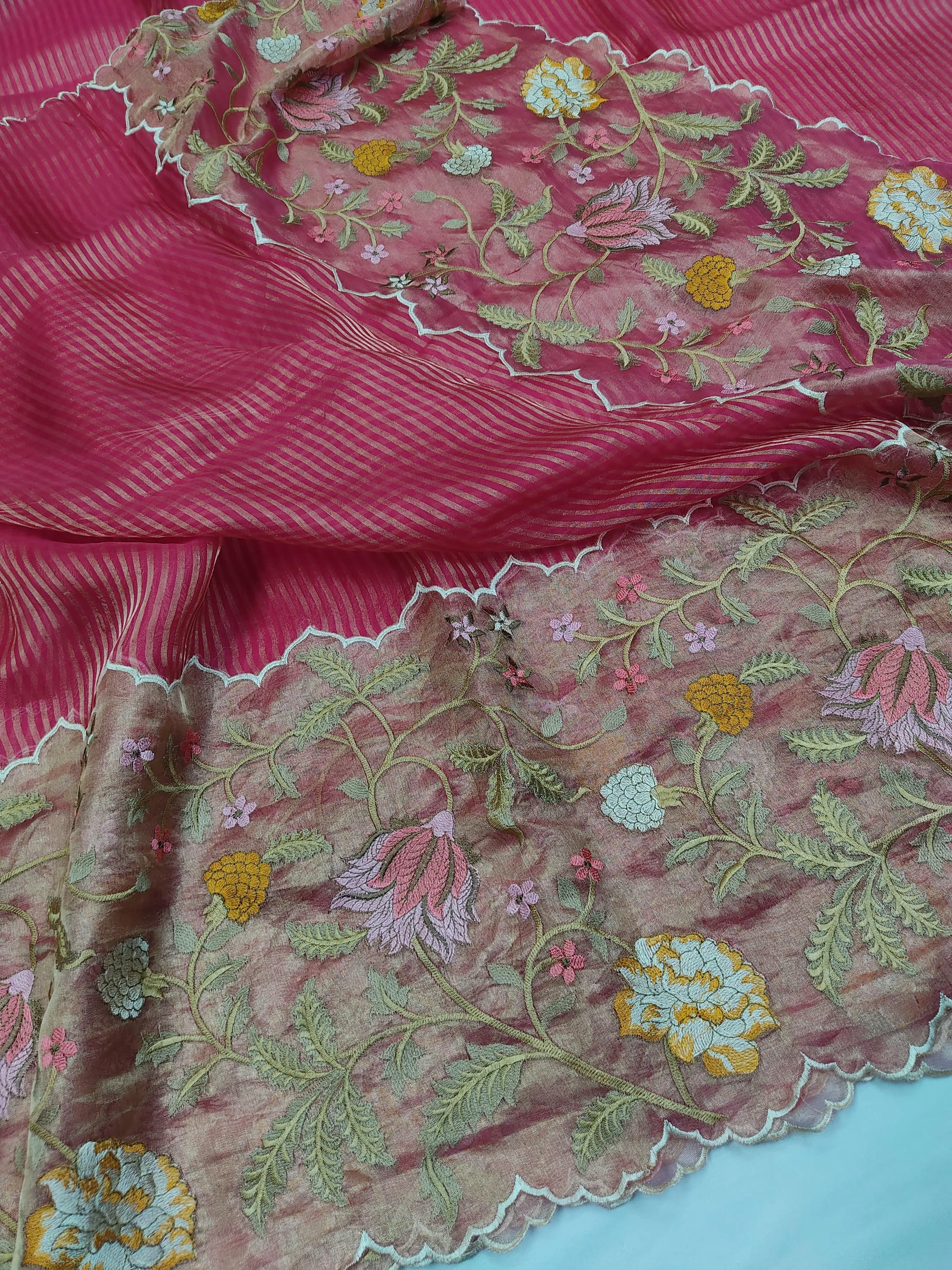 Handwoven pure Banarasi Kora tissue saree in rose pink with gold and silver zari, floral embroidery, and scalloped border