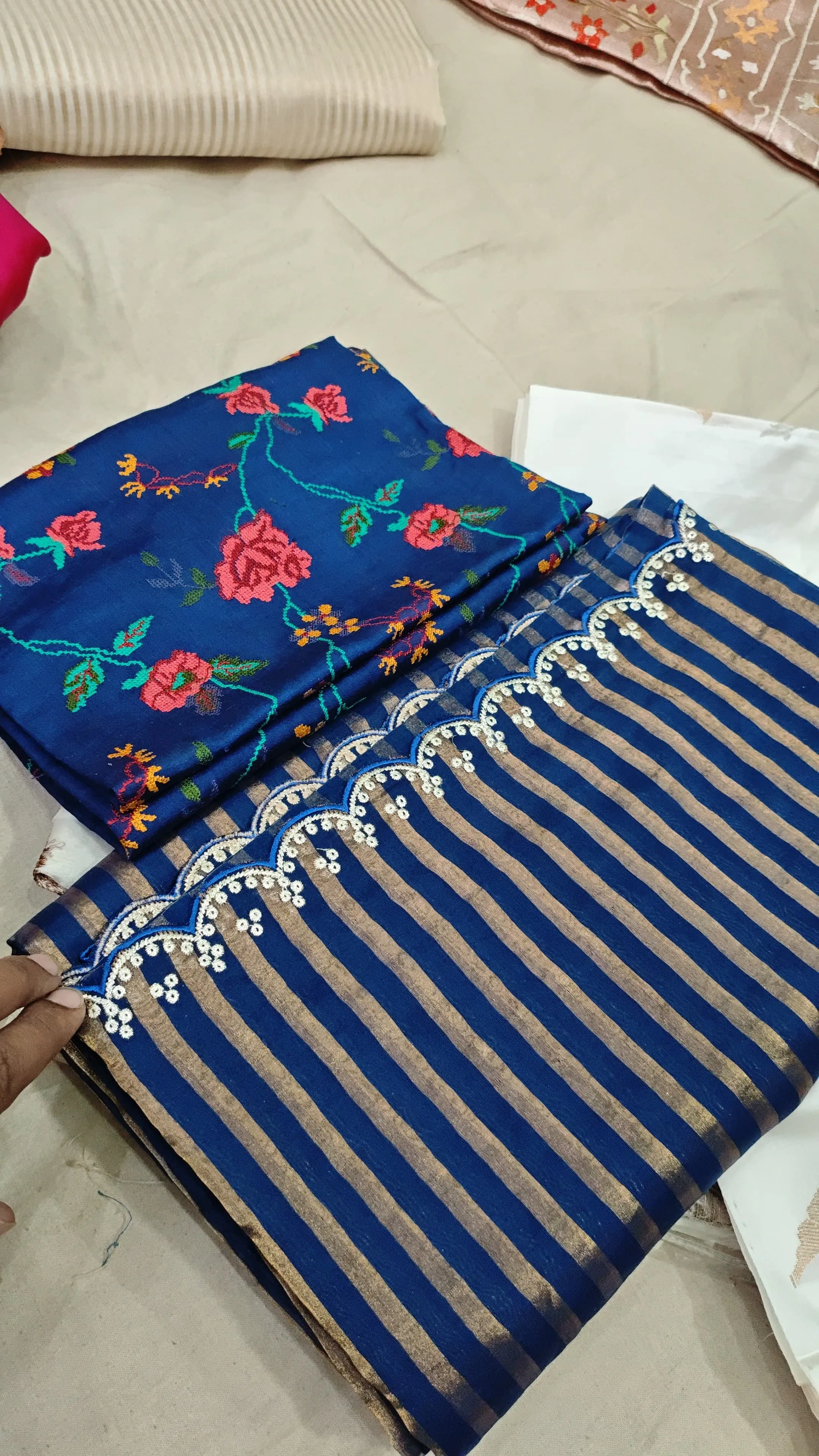 Handwoven Banarasi Kora Tissue Silk saree in royal blue with gold zari stripes and floral Mughal embroidery, ideal for weddings.