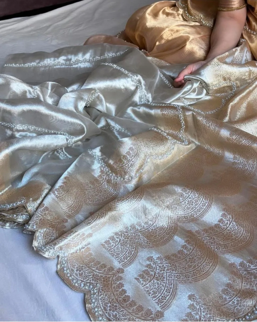 Handwoven pure Banarasi Kora tissue silk saree in silver and gold with intricate golden zari patterns, ideal for weddings