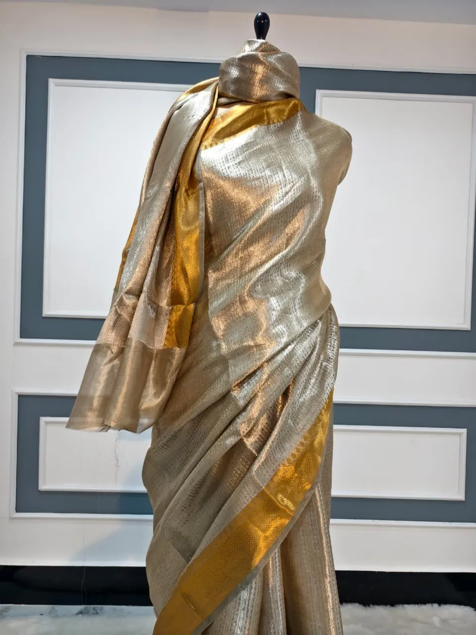 Golden Banarasi pure silk tissue saree with intricate brocade work, featuring a lustrous gold finish and elegant drape.