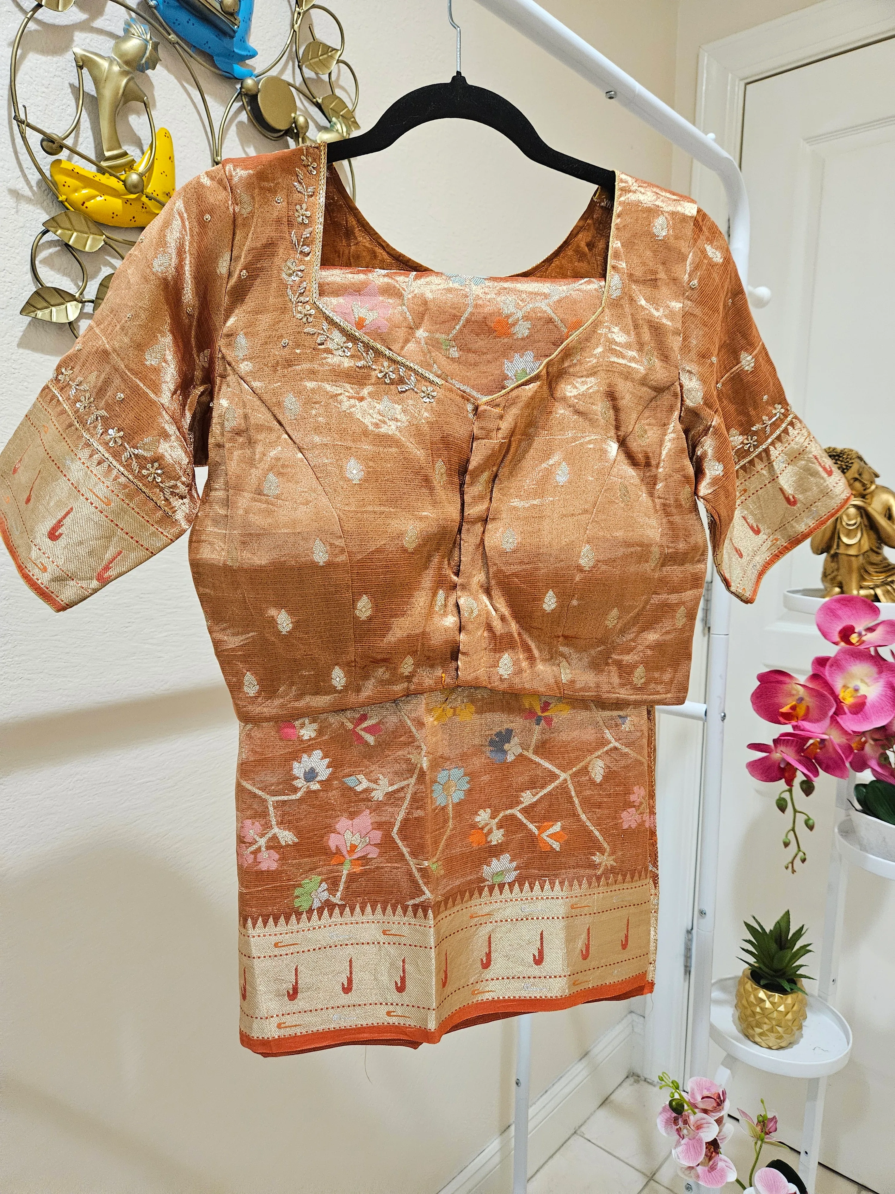Handwoven pure zari Kota double tissue saree blouse in golden sheen with floral motifs and intricate border, ideal for weddings and parties