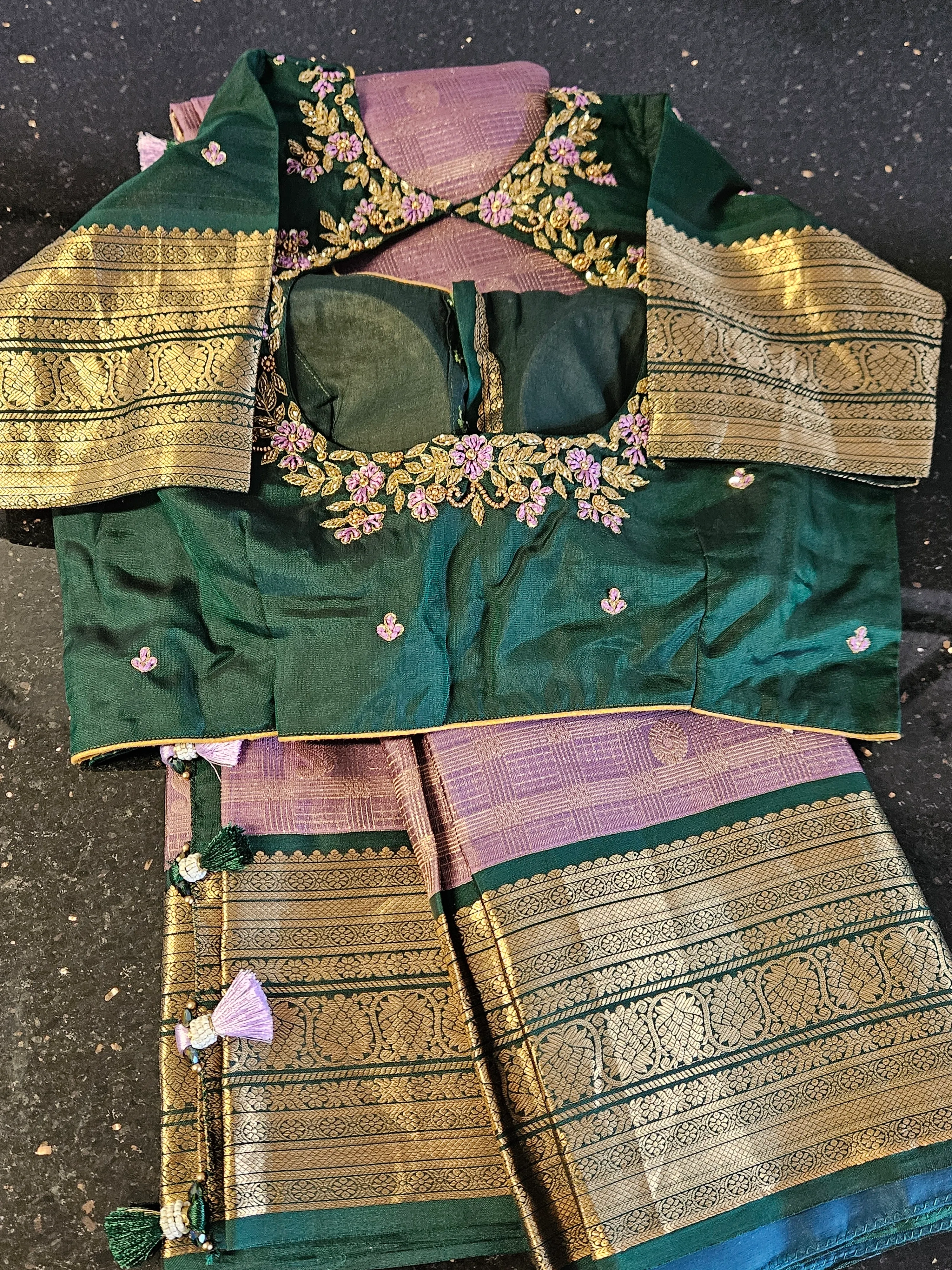 Handwoven pure Kanchipuram silk saree in green and purple with gold and silver zari, paired with embroidered blouse.