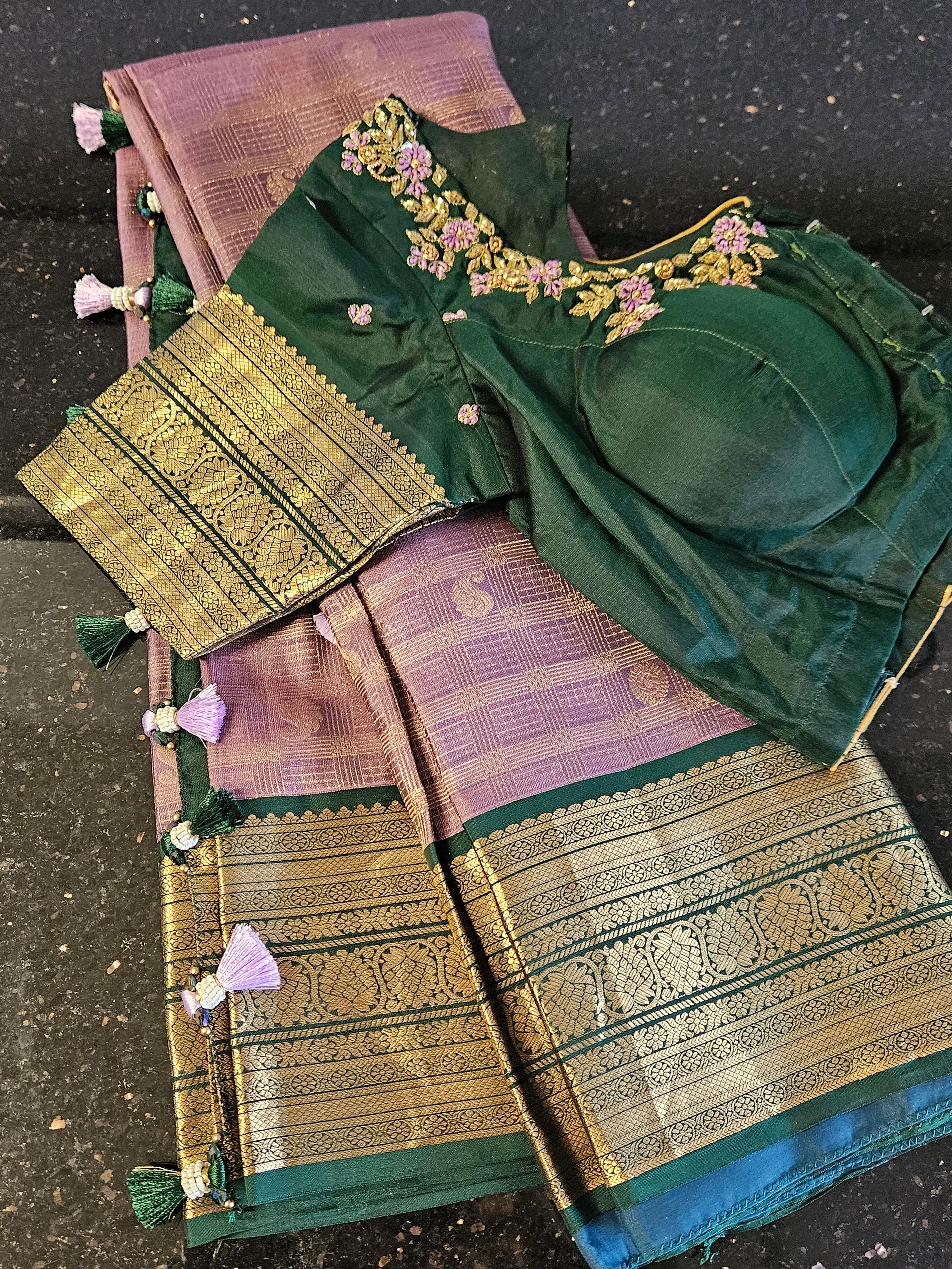 Handwoven pure Kanchipuram silk saree in multicolor with gold and silver zari, paired with green embroidered blouse.
