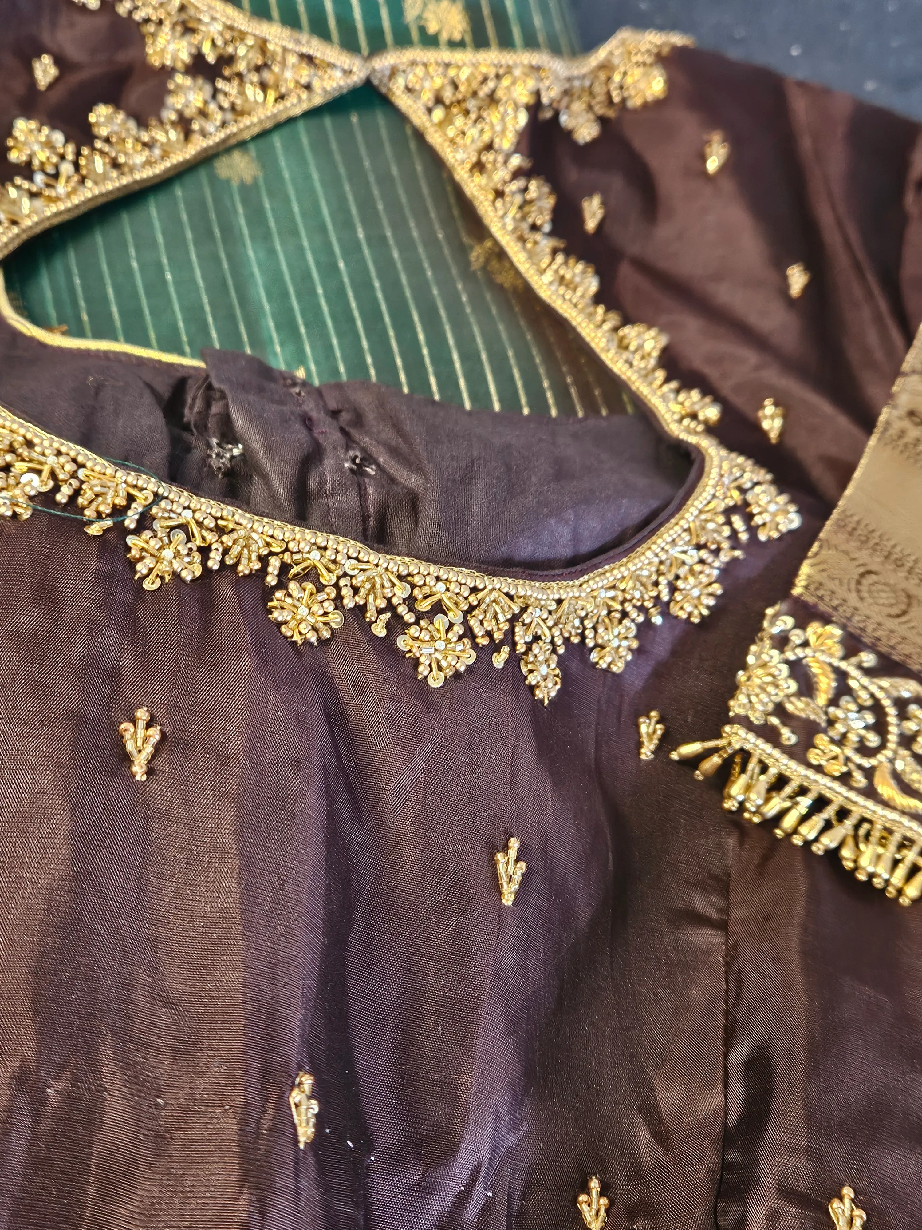 Pure Kanchipuram silk wedding saree in deep purple with handwoven gold zari work, intricate embroidery, and rich texture.