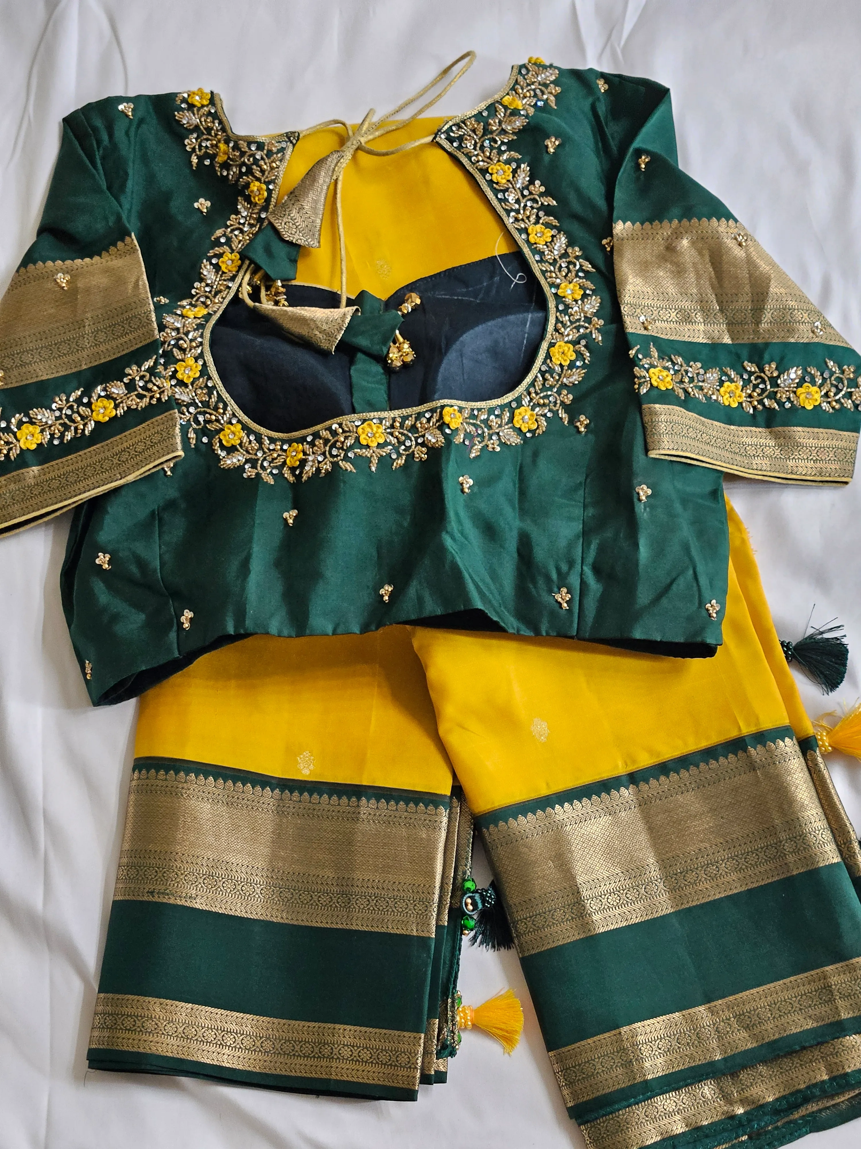 Handwoven pure Kanchipuram silk saree in yellow with green blouse, gold and silver zari borders, floral embroidery