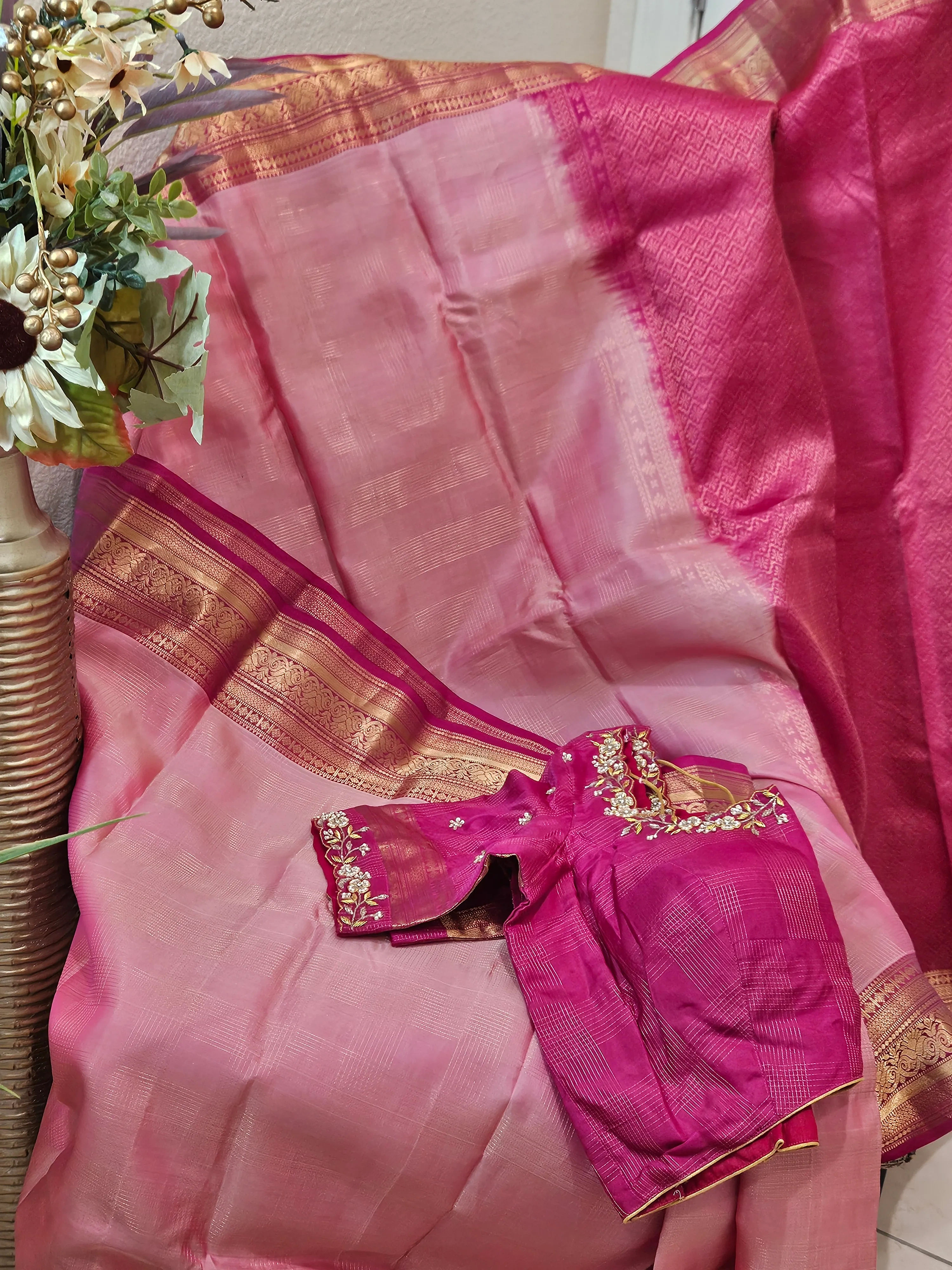 Pure handwoven Kanchipuram silk saree in radiant gold with intricate zari work and contrasting pink blouse, ideal for weddings.