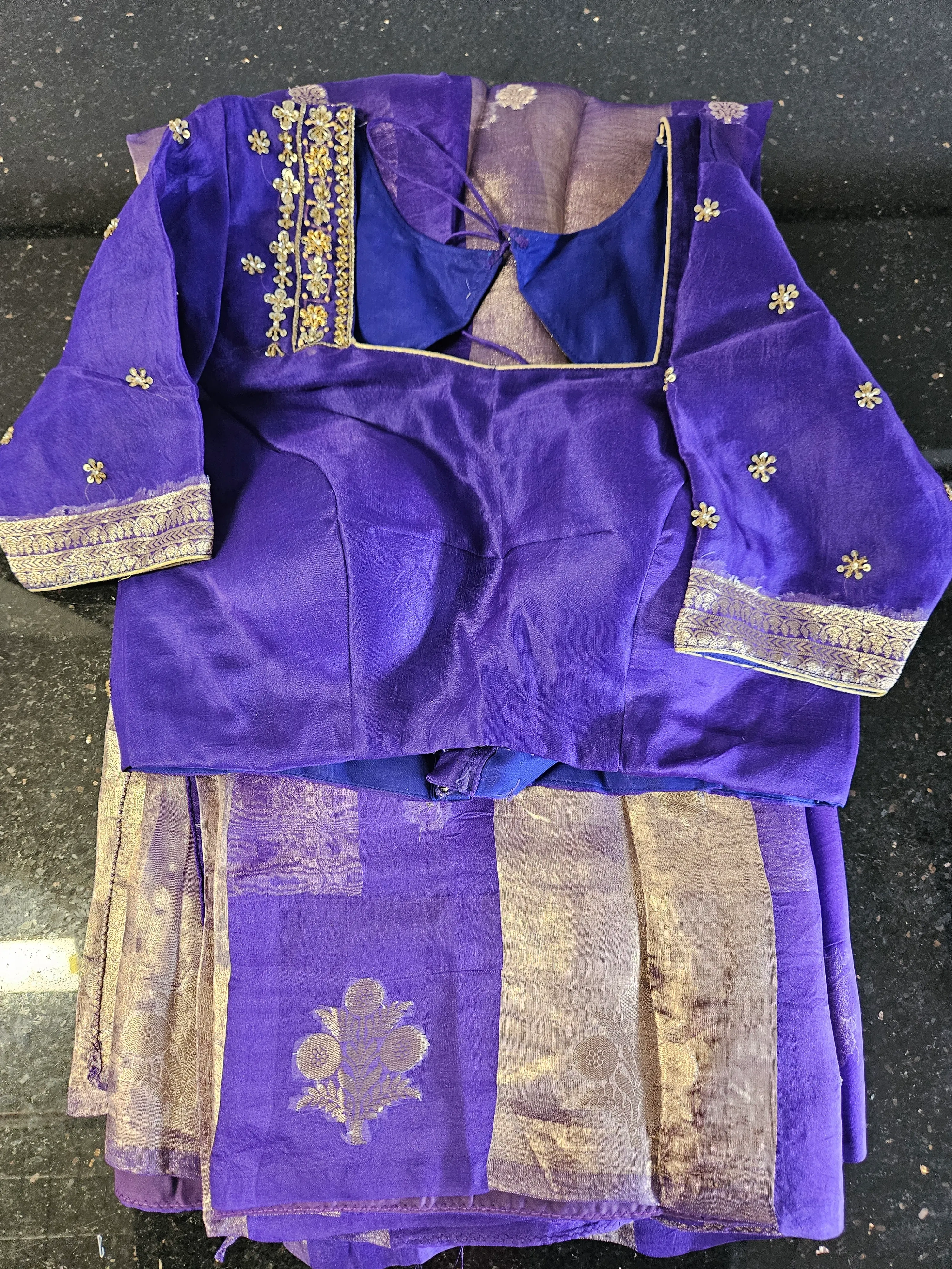 Pure Banarasi Kora tissue silk saree in royal purple with gold zari floral motifs and matching embroidered blouse, ideal for weddings.