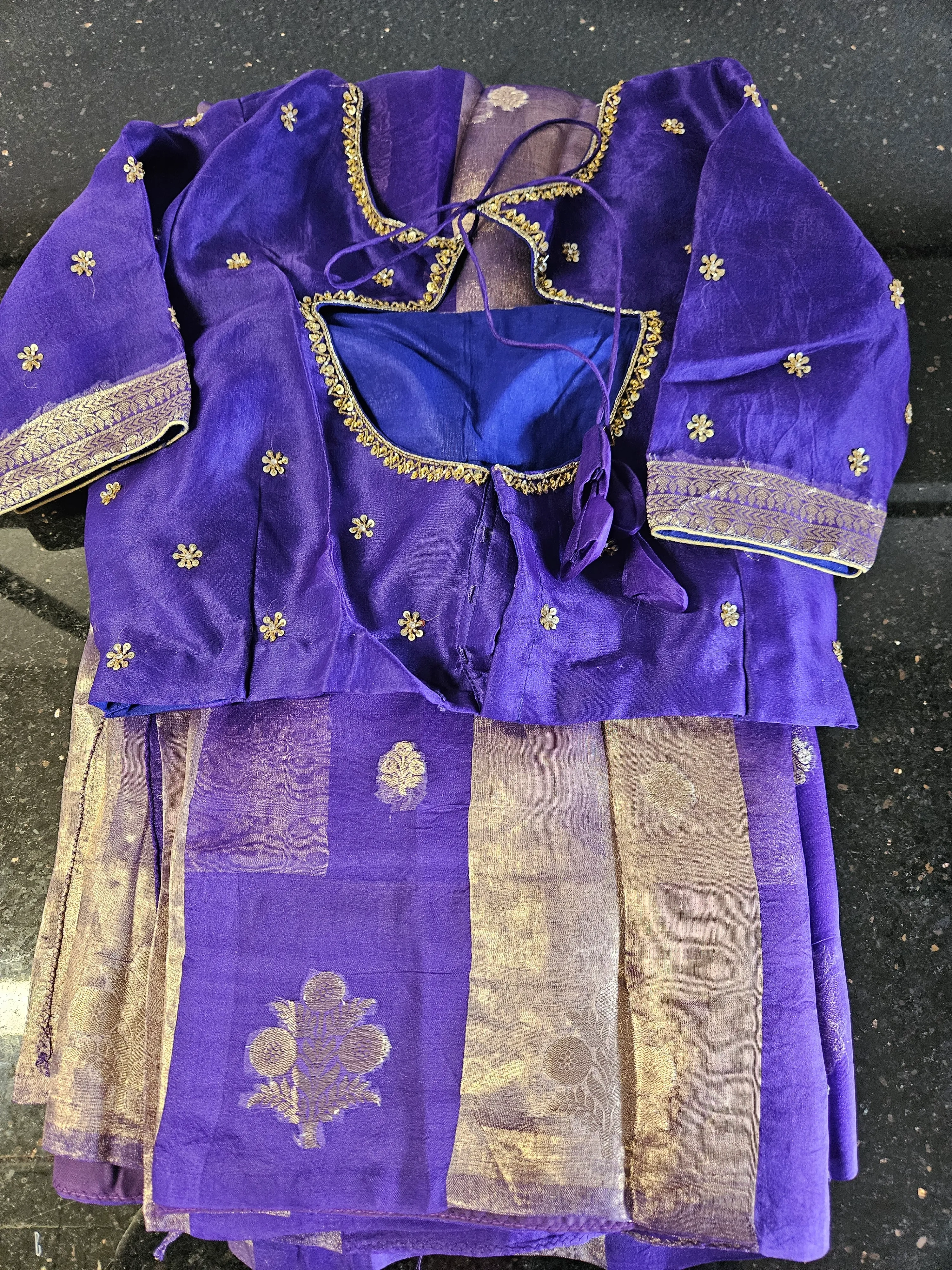 Pure Banarasi Kora tissue silk saree in royal purple with gold zari floral motifs and matching embroidered blouse, ideal for weddings.