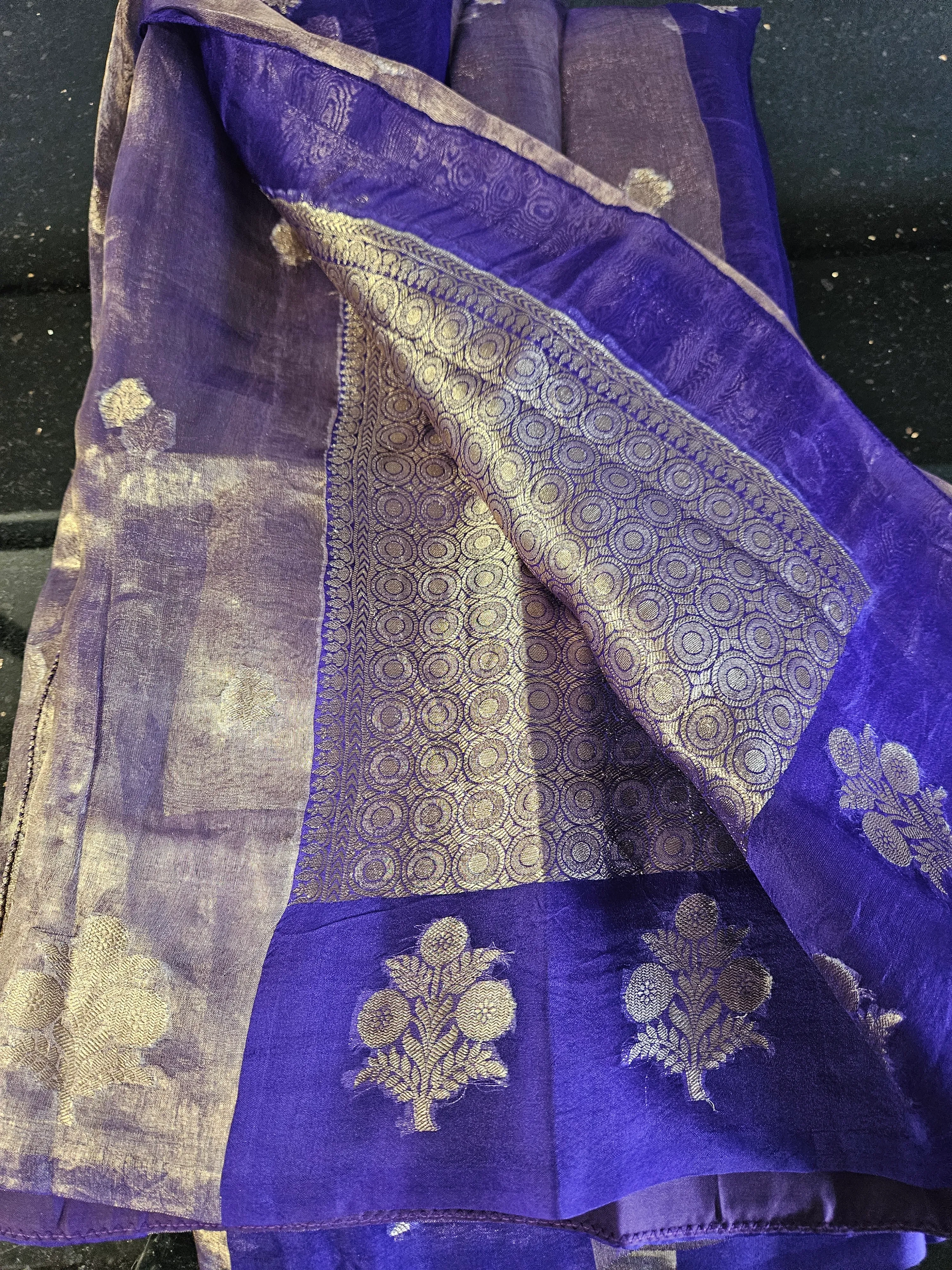 Pure Banarasi Kora tissue silk saree in royal purple with gold zari floral motifs and intricate border, ideal for weddings.
