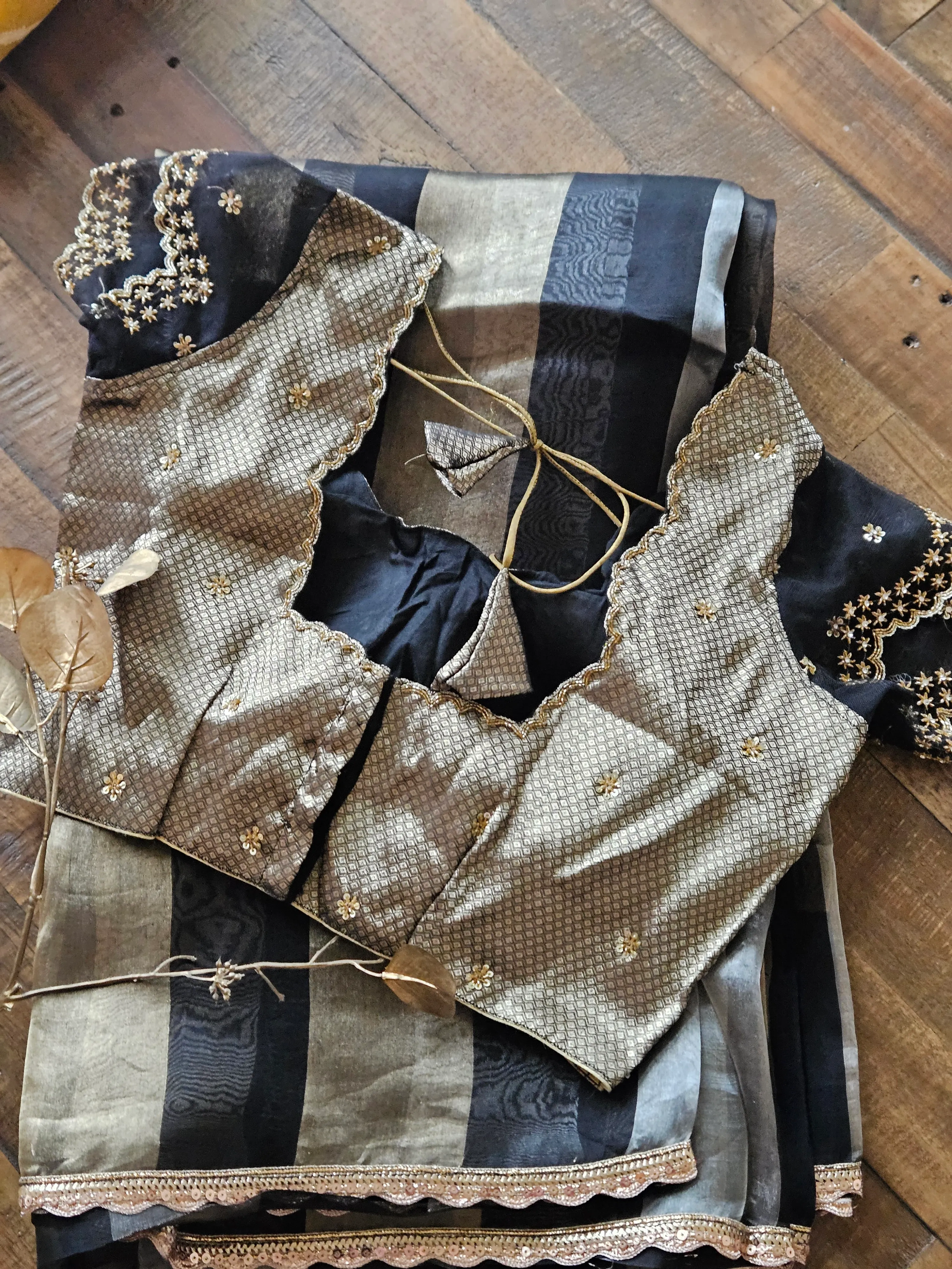 Pure Banarasi Kora Tissue saree in pastel gold and silver stripes with handwoven zari, paired with an embellished blouse.