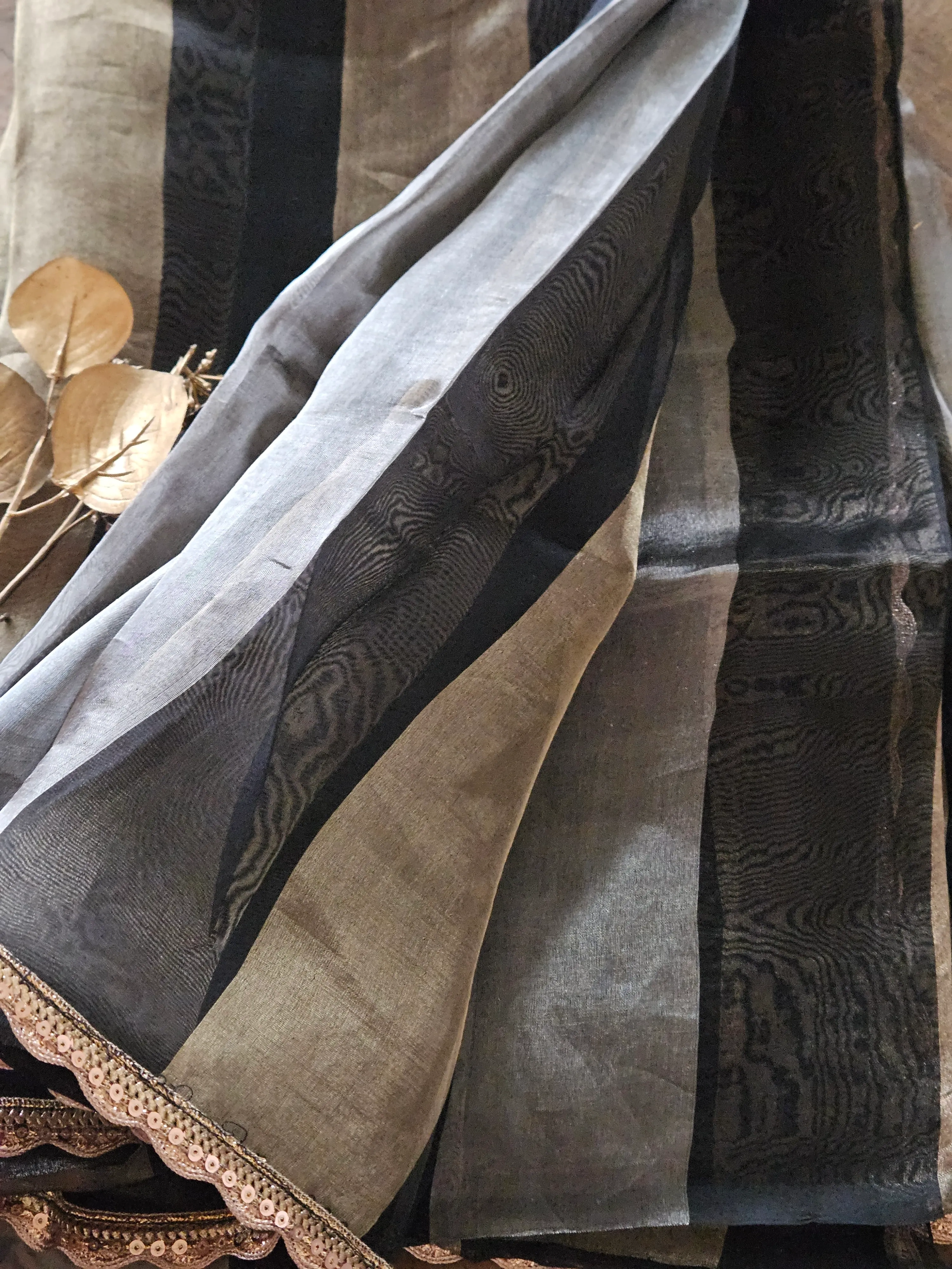 Pure Banarasi Kora Tissue saree in soft pastel tones with handwoven gold and silver zari, featuring elegant striped patterns.