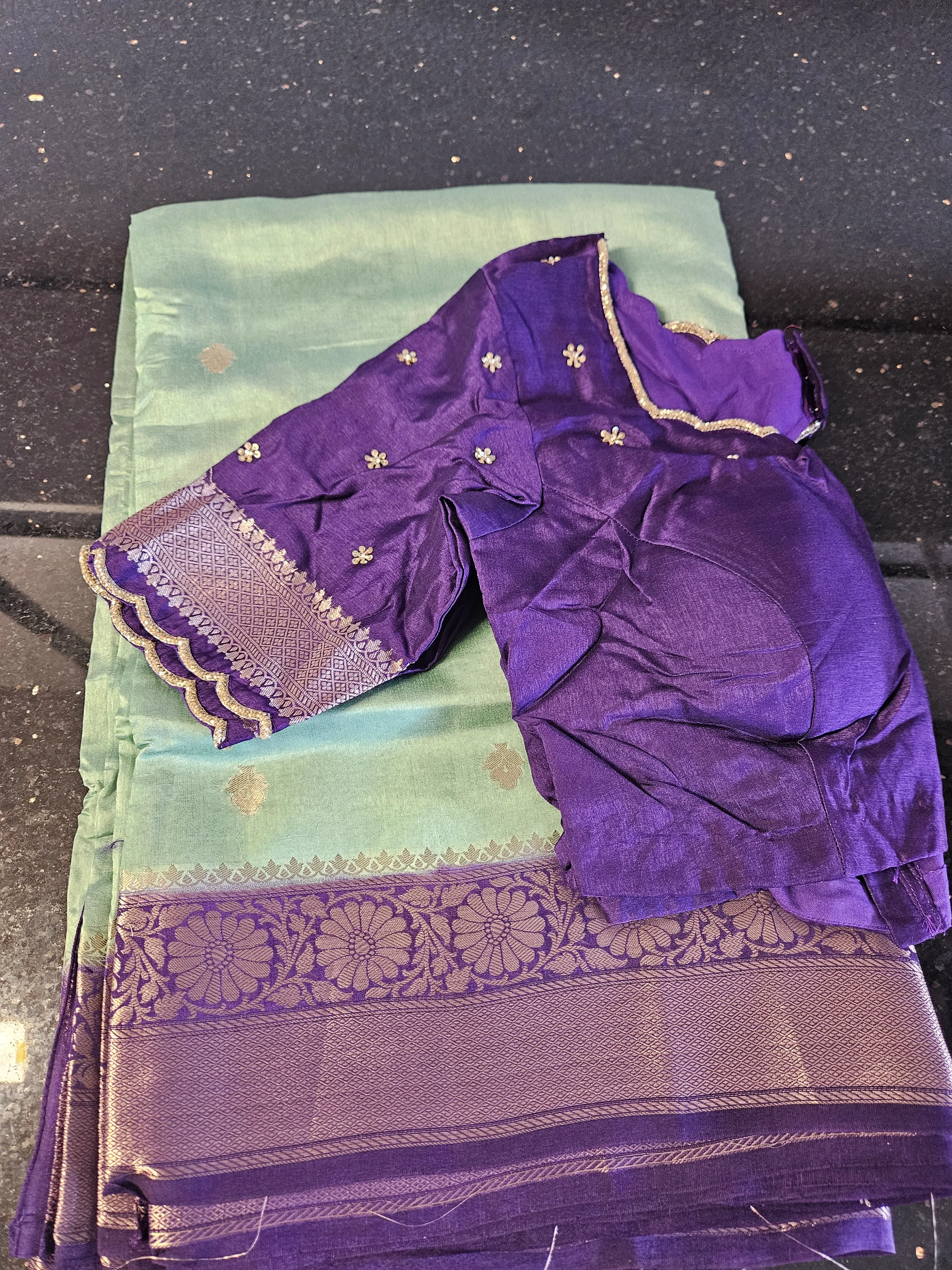 Handwoven pure Banarasi Kora tissue silk saree in mint green with gold zari border, paired with a purple blouse.