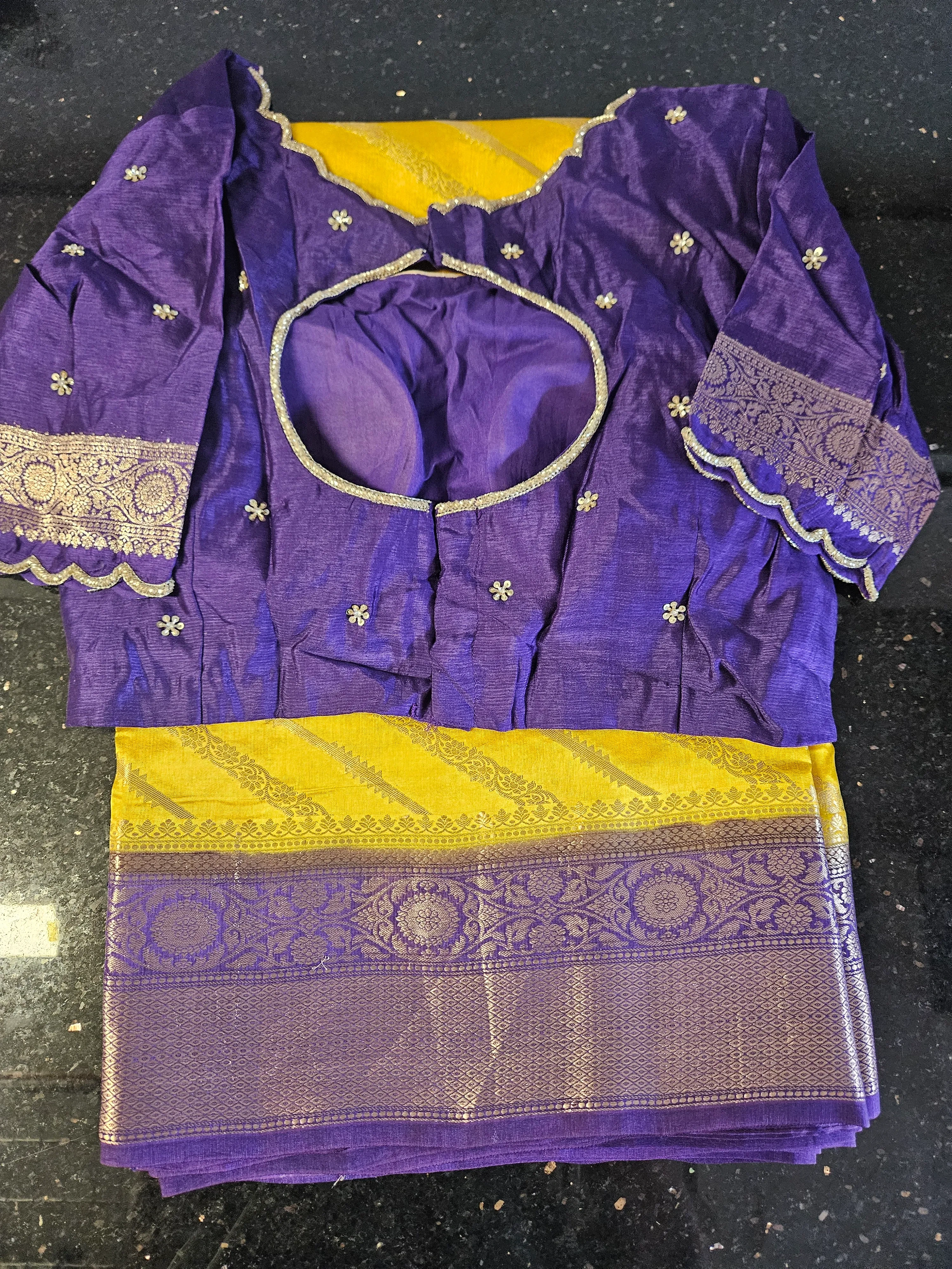Handwoven pure raw mango silk saree in golden yellow with intricate purple border, paired with matching purple blouse.