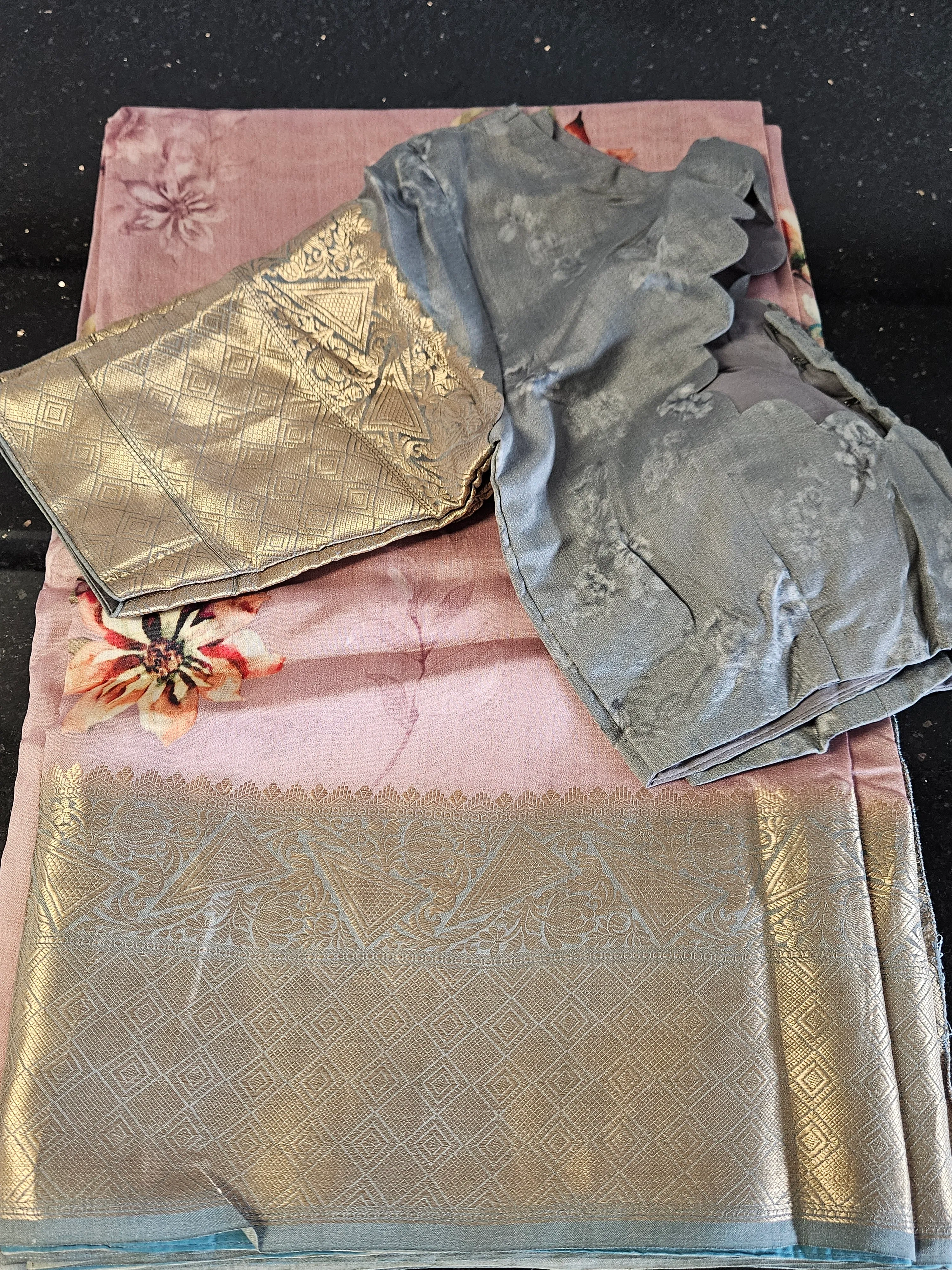 Handwoven Banarasi silk saree in blush pink with gold zari floral motifs and intricate border, paired with grey blouse.