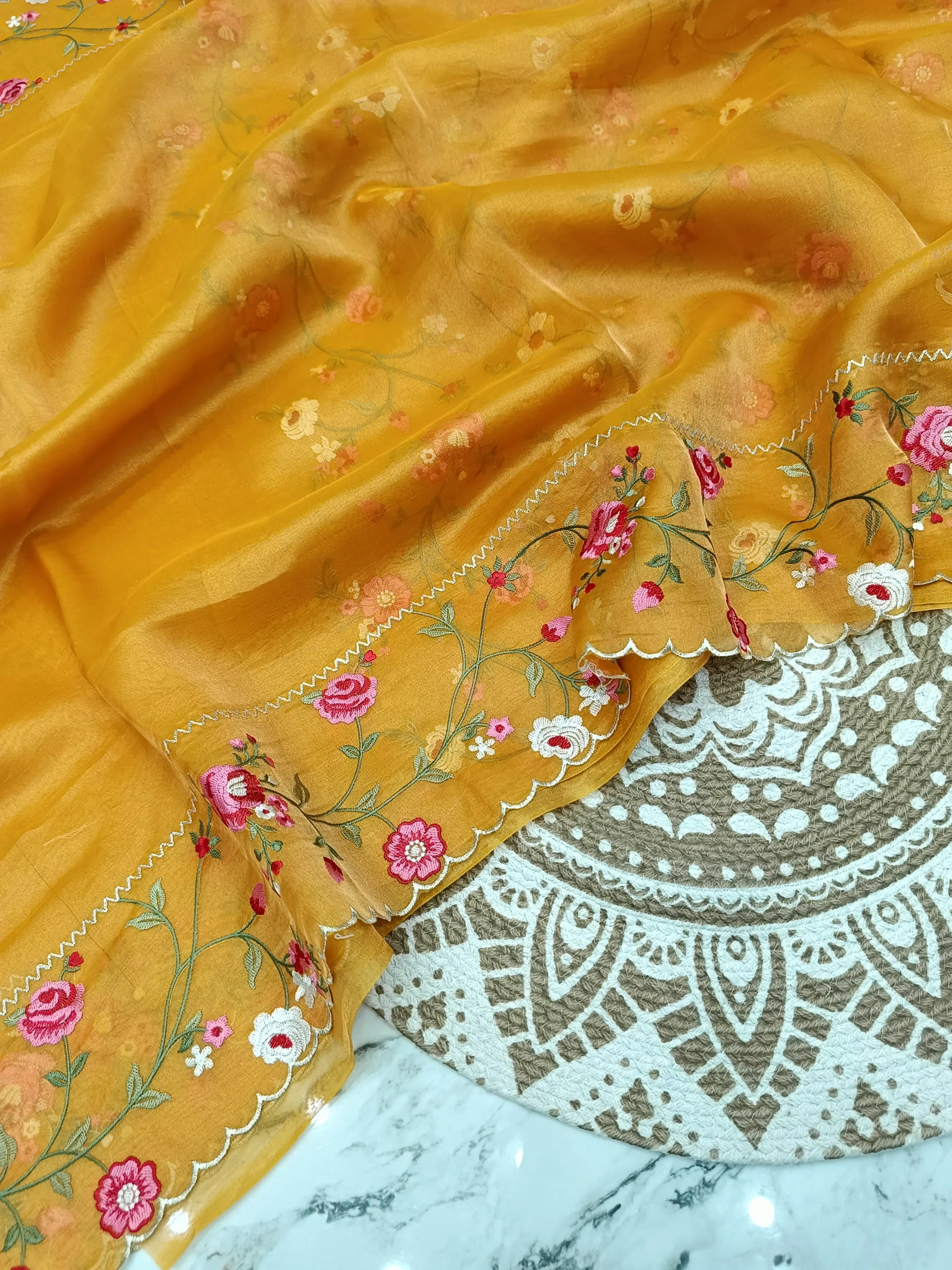 Handwoven Banarasi tissue saree in gold with silver zari, floral embroidery, and scalloped border, luxury wedding wear