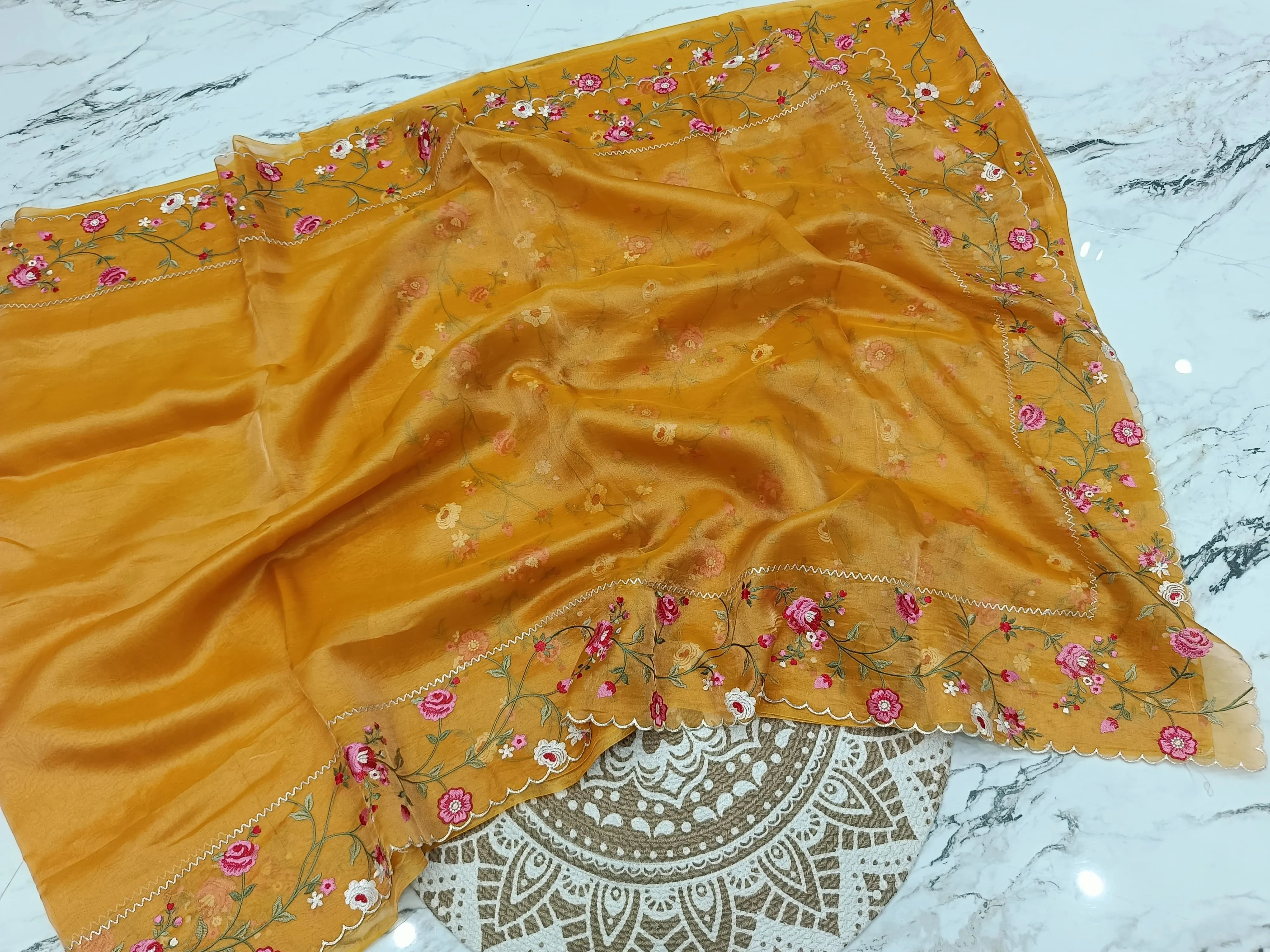 Handwoven Banarasi tissue saree in gold with silver zari, featuring floral embroidery and scalloped border, luxury wedding wear