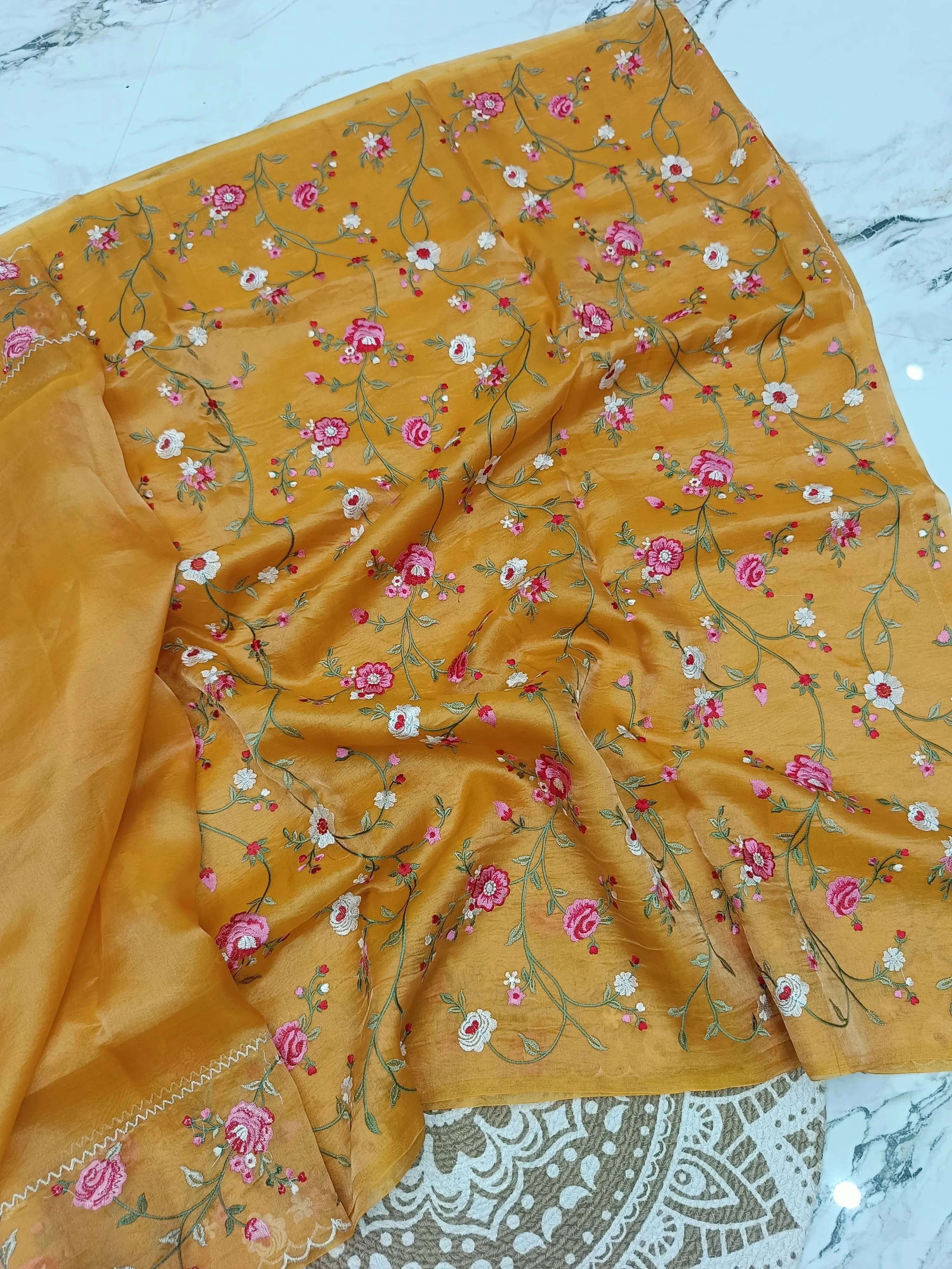 Handwoven Banarasi tissue saree in gold with silver zari, featuring pink and white floral embroidery, luxury wedding wear