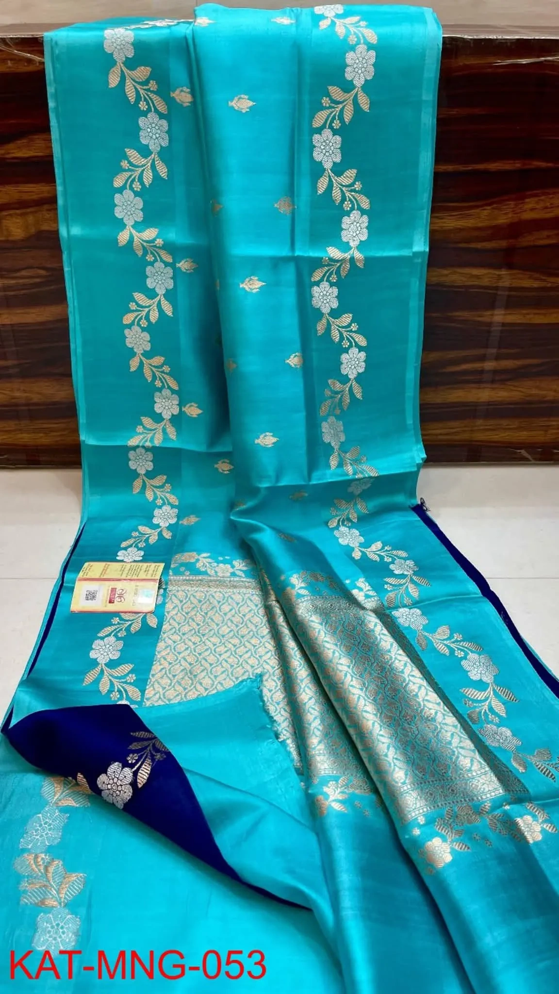 Handwoven pure pattu silk saree in raw mango yellow with intricate gold zari floral motifs and rich pallu, perfect for weddings.