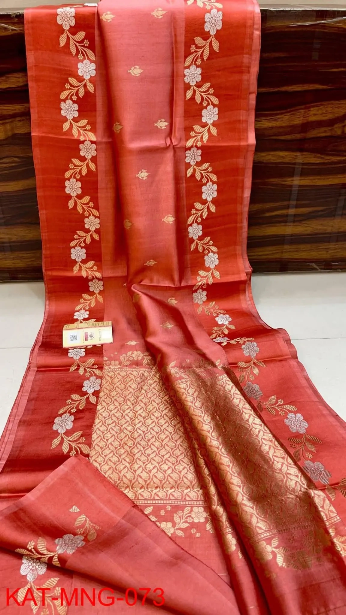 Handwoven pure pattu silk saree in raw mango yellow with gold zari floral motifs and intricate border, perfect for weddings
