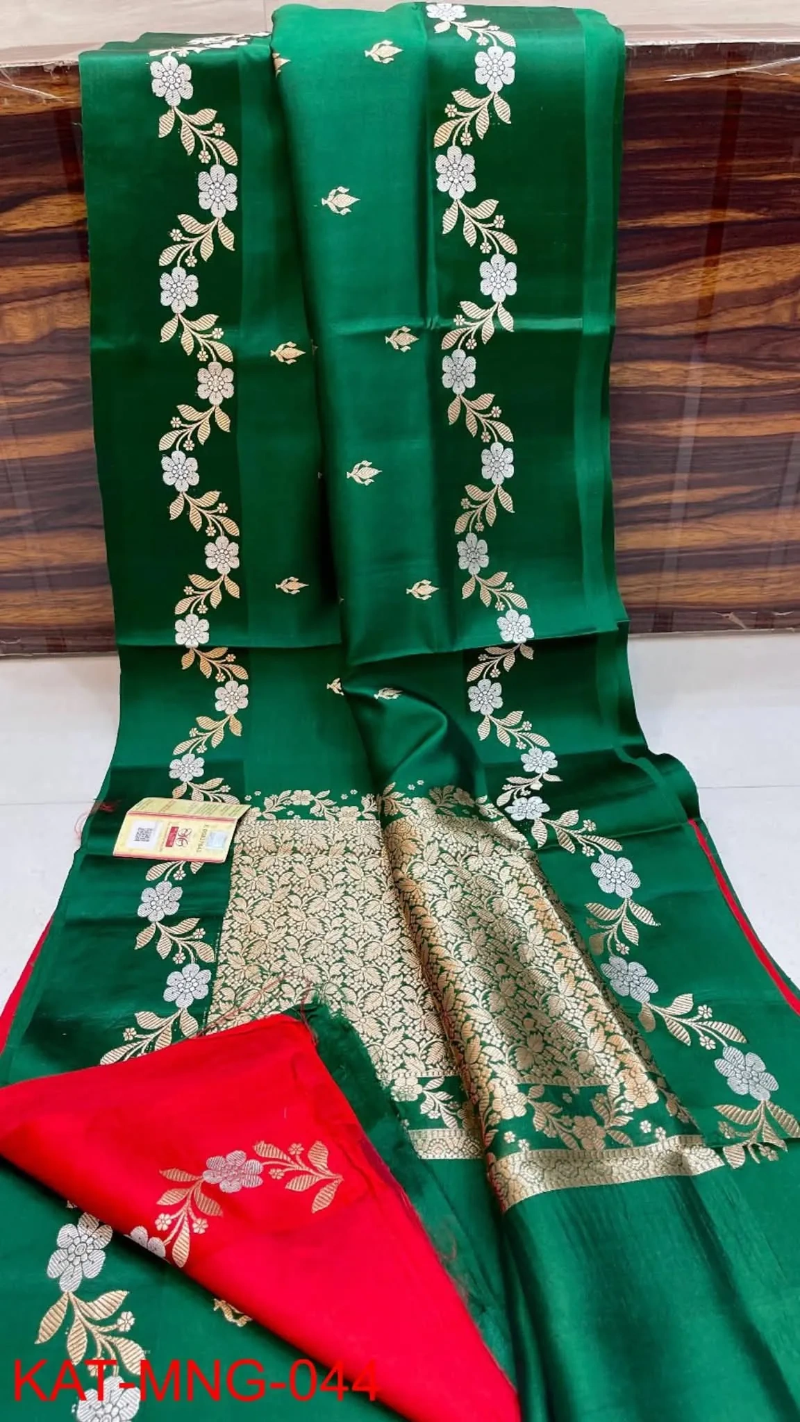 Handwoven pure pattu silk saree in raw mango yellow with gold zari floral motifs, red border, and intricate pallu design