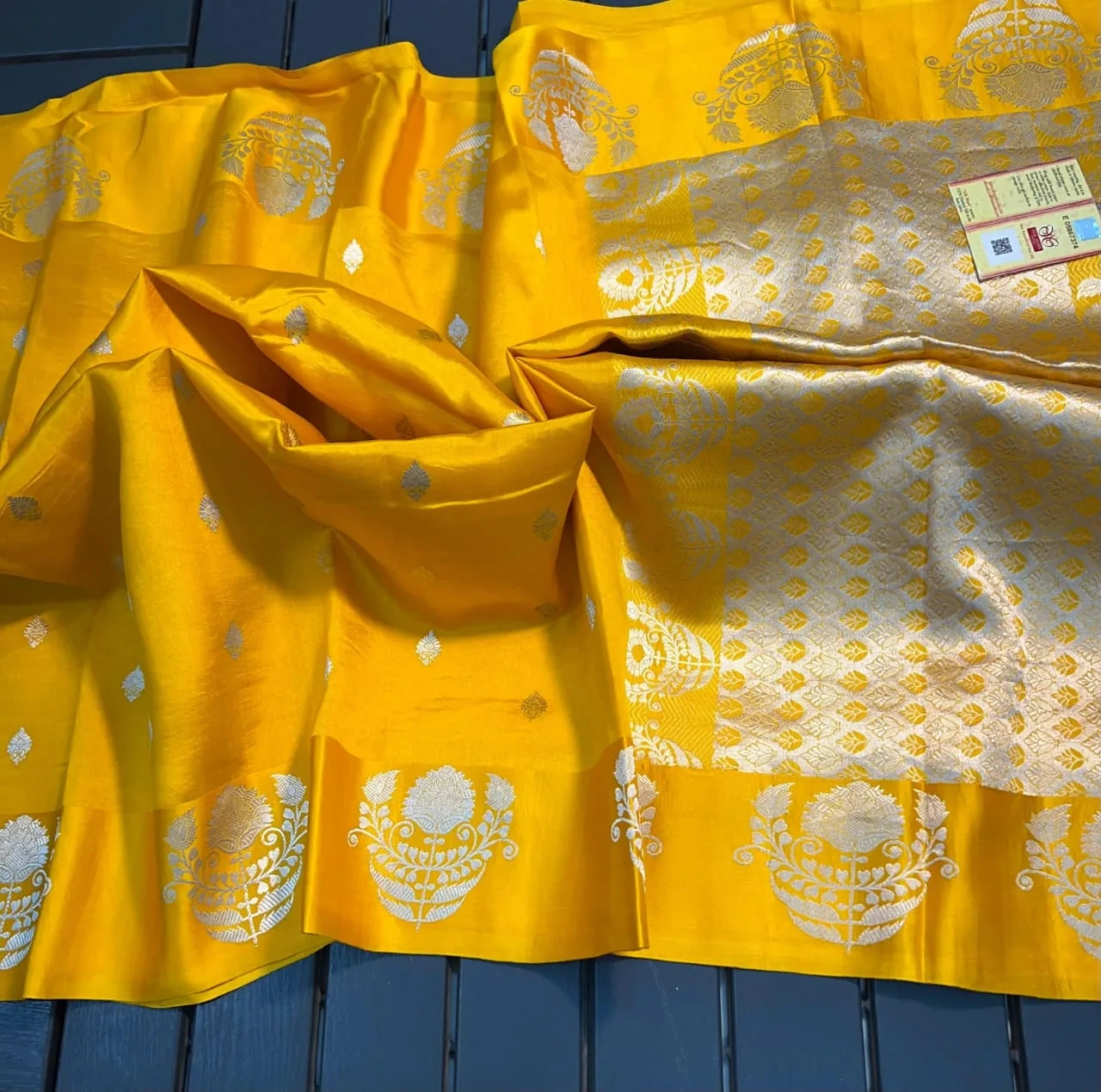 Handloom raw mango green pattu silk saree with rich golden zari border and intricate floral motifs, ideal for weddings and festivals