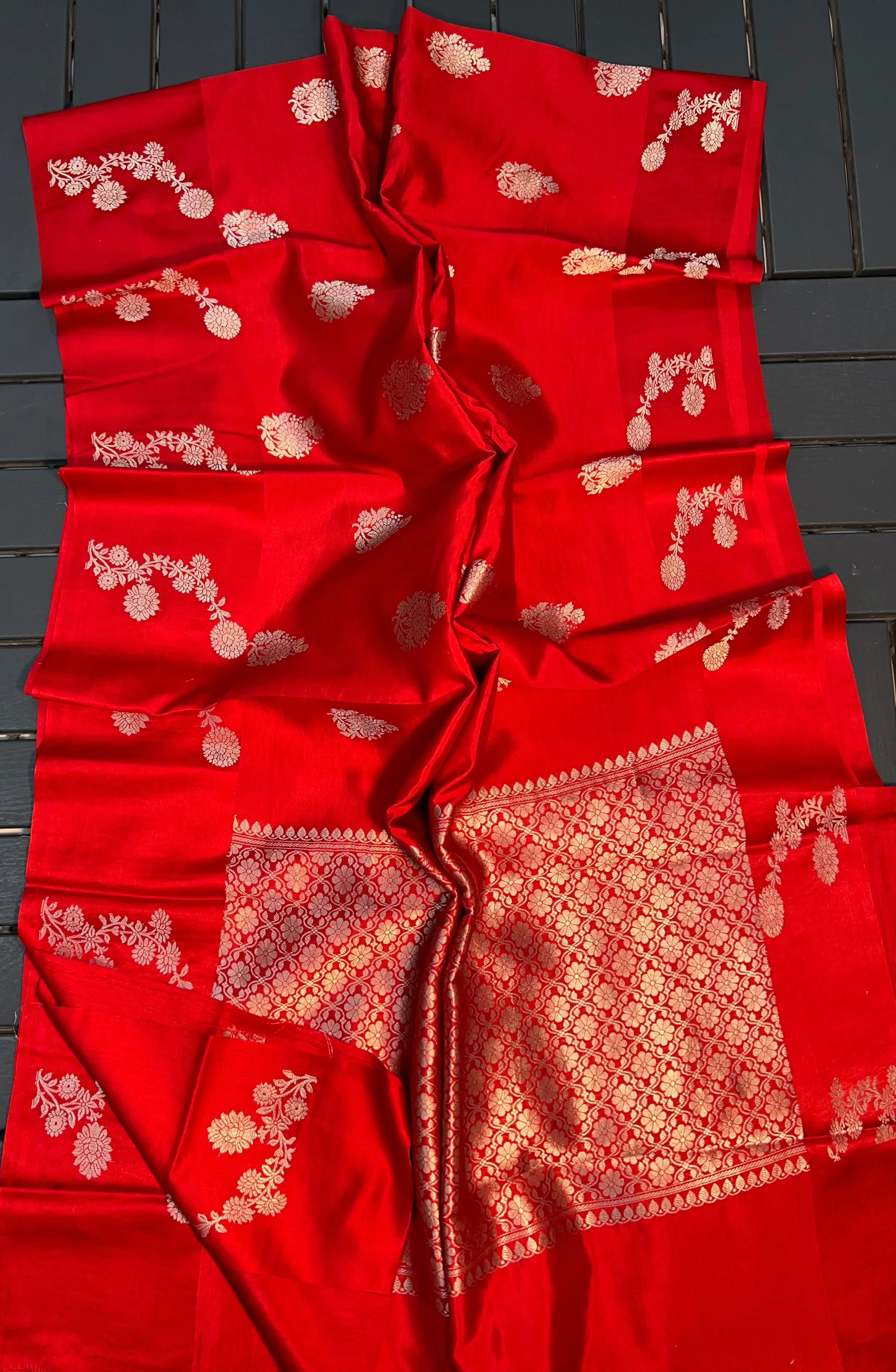Handloom pattu silk saree in vibrant red with intricate gold zari floral and geometric motifs, ideal for weddings and festivals