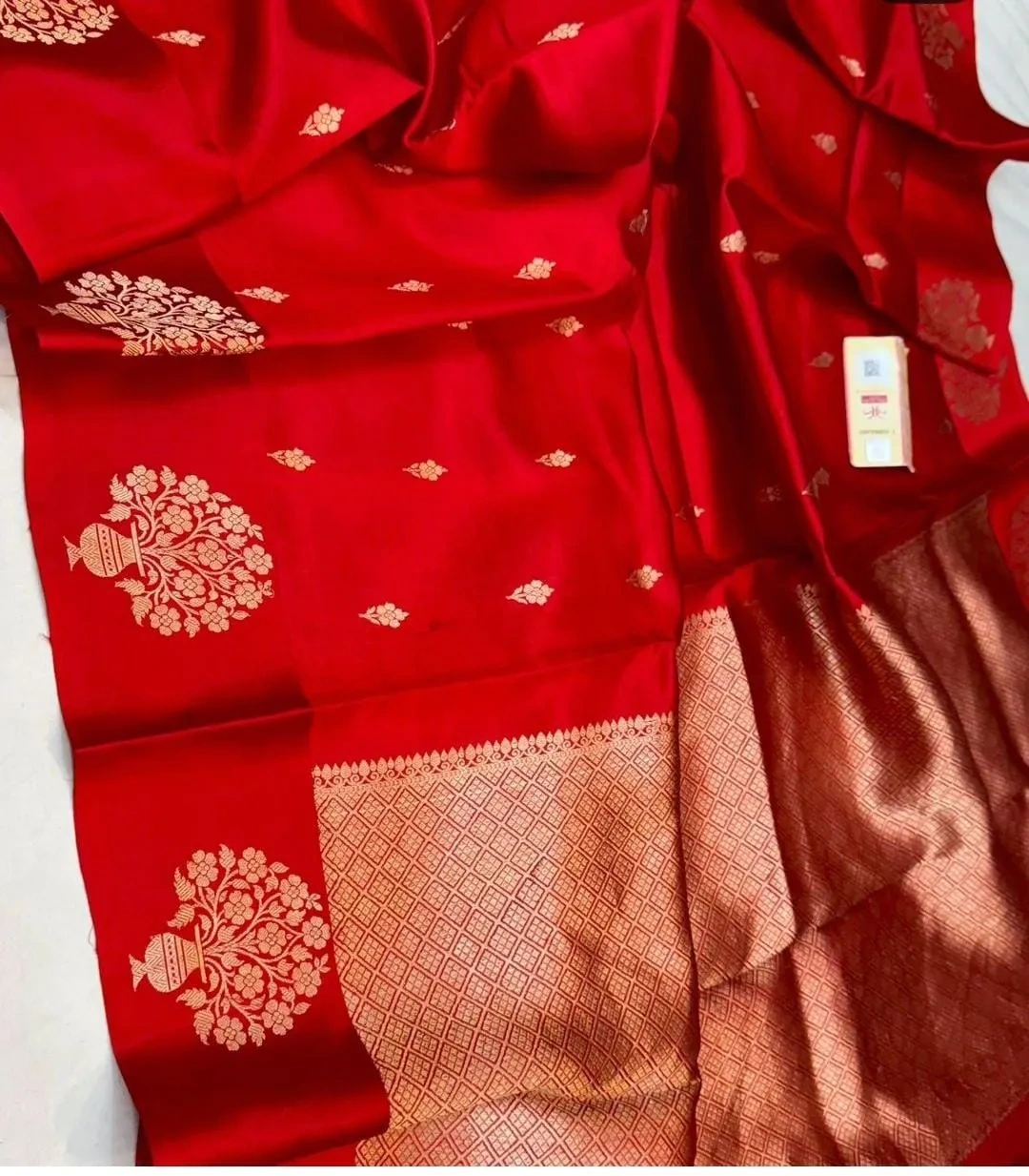 Handwoven raw mango yellow pure silk pattu saree with gold zari motifs and intricate border, ideal for weddings and festivals