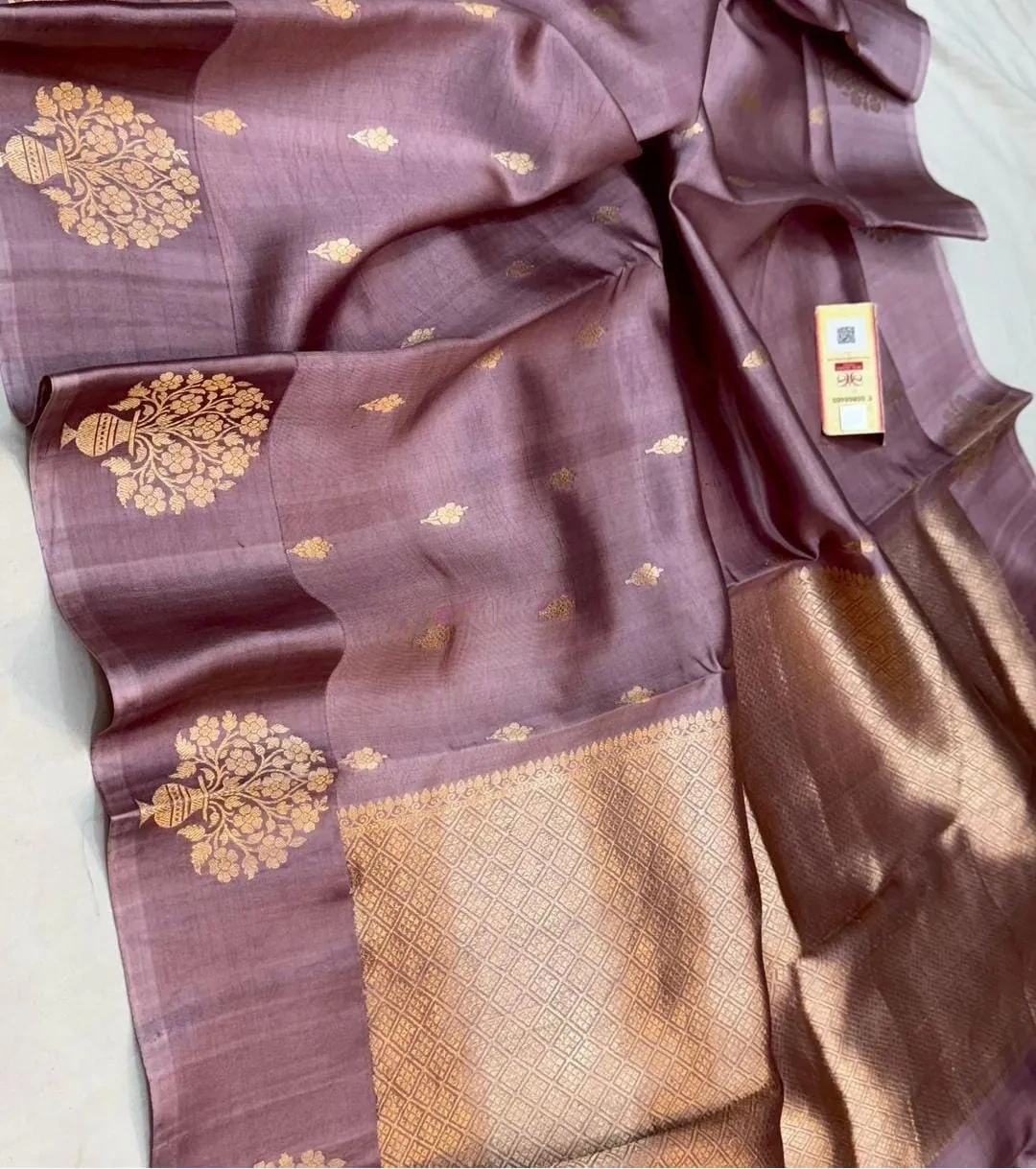 Handwoven raw mango yellow pure silk pattu saree with gold zari floral motifs and intricate pallu, ideal for weddings and festivals